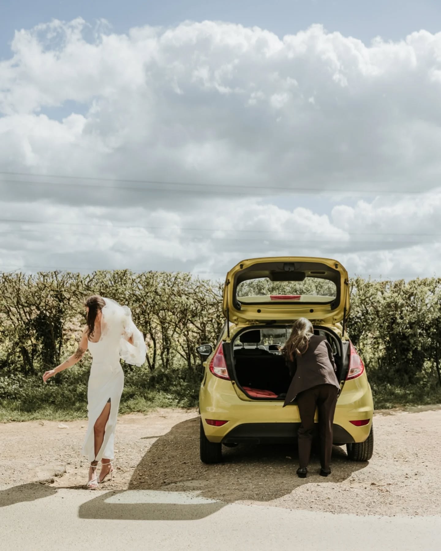 Megan & Lorna. Sun shining down, just eloped and ready for their next adventure. 💛
