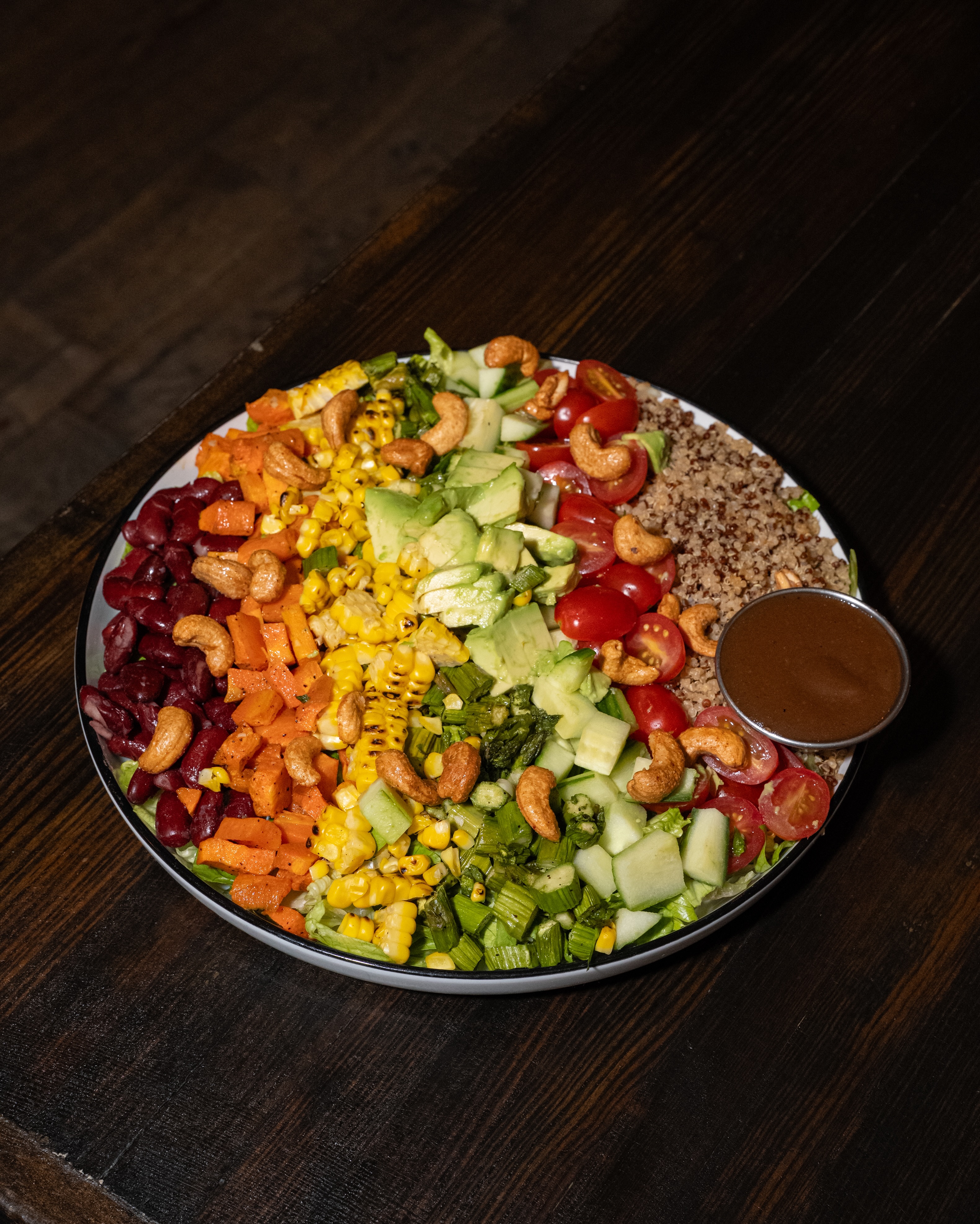 She’s pretty, she’s fresh, and she’s waiting for you. The Pom Cobb Salad is on the menu. We’re on Ditmars.