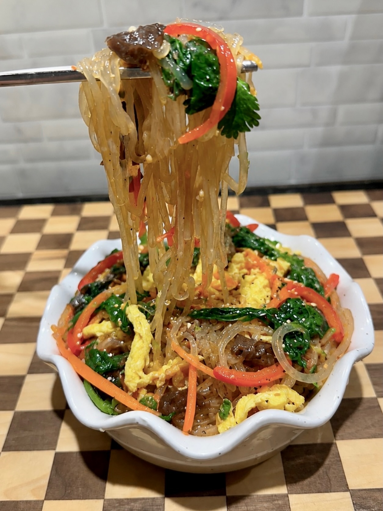 Glass noodles. Garden vegetables from our @harmonyhomestead.tx. Balanced flavor.
Our Harmony Japchae combines silky noodles, fresh vegetables, mushrooms, and farm fresh egg in a colorful Korean-inspired dish. Simple, satisfying, and full of flavor.
#HarmonyHomeCollective #Japchae #FusionCuisine #WacoFoodie #CateringWithPurpose