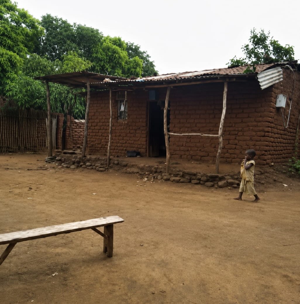 This is the home of the Mayere family, who live locally to Hope Skills Centre, and are the first family in the wider community to benefit from our stove-making programme.
The family has nine children, ranging in age from 2 to 22 years old. Two of the children are deaf and are currently unable to attend school. Four of their children, aged 8, 10, 16 and 18, are attending primary school, but because of the challenges they have faced in accessing education, they remain in classes with much younger children.
The children’s father works hard to provide for his family, taking on small jobs whenever work is available. However, the income he earns is not enough to meet the needs of such a large household.
The family’s home reflects some of the challenges they face. It has an earth floor and an ageing roof made from old iron sheets. One side of the house previously collapsed and has been repaired using whatever materials were available, so that the family could continue living there.
These improved stoves that we are building offer several important benefits. They reduce the amount of firewood needed for cooking, helping to protect local trees and the environment. They also save time for families and produce less smoke, creating a healthier cooking environment.
By supporting families such as the Mayeres through projects like the fuel-efficient stove programme, we hope to improve daily life, reduce the amount of firewood needed for cooking, and create healthier home environments. We are grateful for the opportunity to walk alongside families like theirs as they work towards a brighter future.
We look forward to expanding the project further in the coming months.