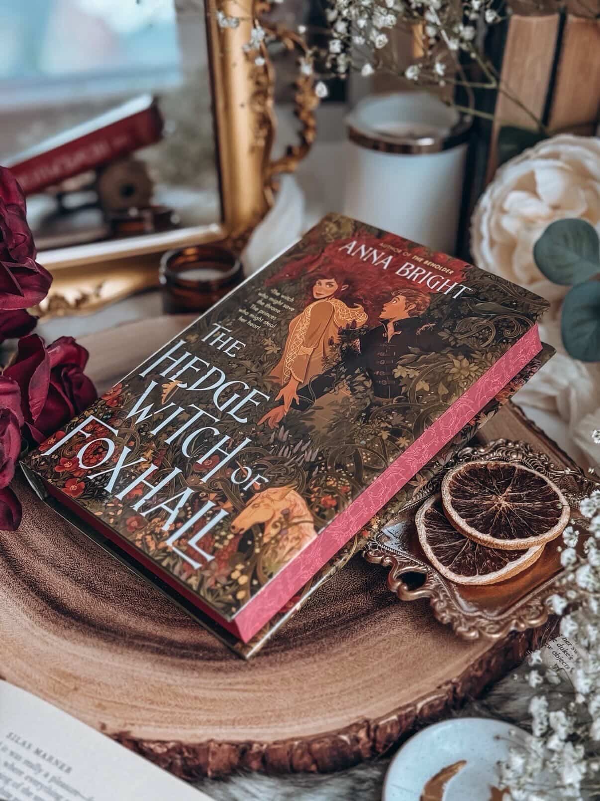 @romantasyinthevalley is going to be the go to place for special editions this summer!
The Hedgewitch of Foxhall by @brightlyanna with exclusive event edges designed and printed by @bookish_signs will be available at the on site book store for purchase at the event.
🎟️ $15
📍 @embassysuiteshuntvalley
🗓️ 7/25/26
Get yours and get it signed and personalized by author @brightlyanna on site!
SO THANKFUL FOR THE TALENTED @thebookscript FOR TAKING THESE AMAZING PHOTOS AND SHARING HER SKILL WITH US ❤️
SYNOPSIS
In this gorgeous stand-alone cozy fantasy romance perfect for fans of Margaret Rogerson and Allison Saft, a rebellious witch undertakes a last-ditch quest to restore magic to medieval Wales—as two princes vie for her heart.
Magic is fading from Wales—choked off by King Offa’s Dyke, the enemy earthworks that spans the entire border. Even the dragons have disappeared. And now an attack is imminent.
Prince Taliesin would love to watch magic die. Prince Dafydd fears it, and the throne. But when their father promises the crown to whichever son can destroy the dyke and restore magic to Wales, the brothers are forced into an uneasy rivalry.
Ffion works hedgewitch magic for poor folk, not princes. Unlike the power-hungry Foxhall coven, she uses only what nature can spare. But when the coven’s greed costs Ffion everything, she will need power beyond her wildest dreams to get back what she’s lost.
So when Prince Taliesin arrives, begrudgingly seeking a witch’s aid, Ffion agrees to help him—even if it means walking from one end of Wales to the other with the most useless peacock she’s ever clapped eyes on. Even if it means striking a bargain with Dafydd behind Tal’s back. The fate of Wales depends on their quest . . . and so might the fate of Ffion’s heart.
#annabright #ritv26 #romantasy #bookcon #eventedition