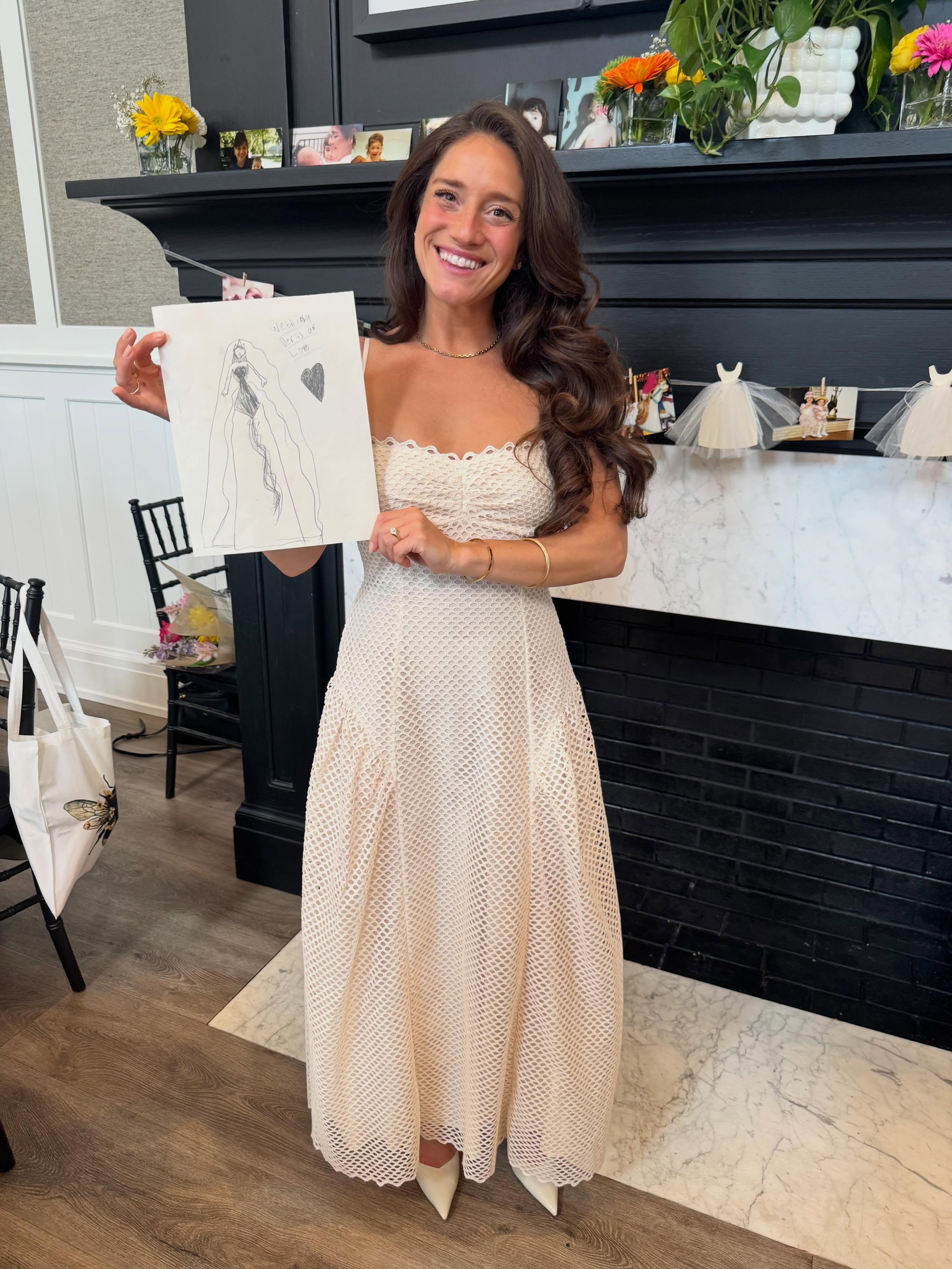 One of our brides at her bridal shower this weekend, holding a drawing she made at 7 years old of her âwedding dress of love.â đ„č
88 days until you can wear your real life wedding dress of love! đ€ @kristen_suarez