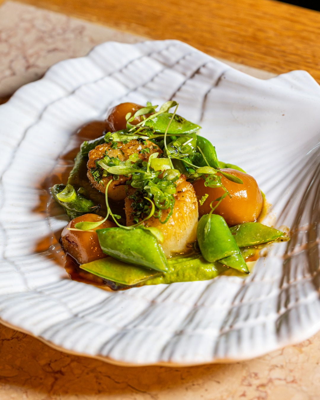 Hokkaido scallops with legumes, wasabi, turnip, and gremolata — bright, precise, and just a little a spice where it counts.