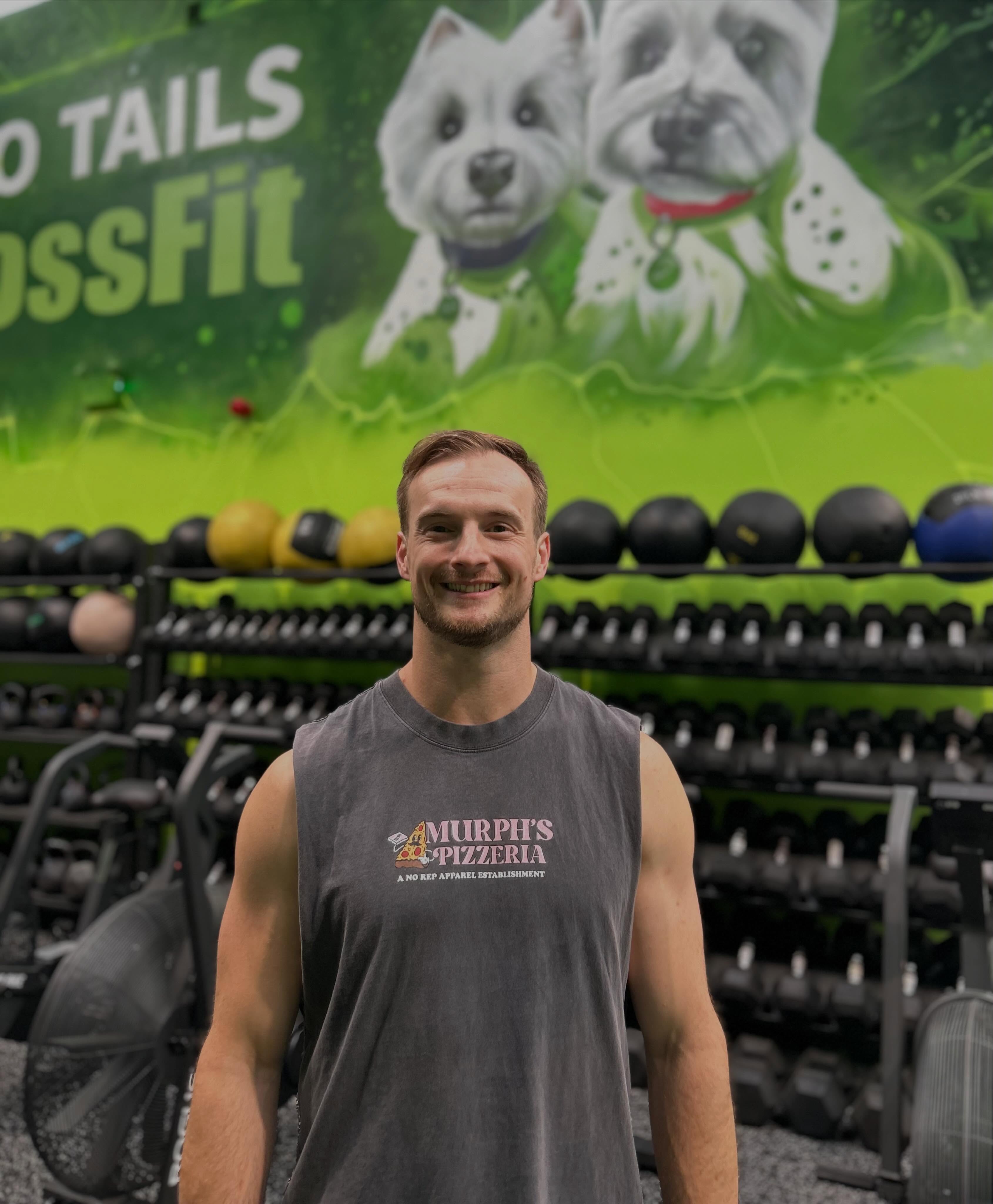🟢 Introducing the newest member of the Two Tails coaching team, Ash Rumble, you can find him at @ashjrumble
🟢 Ash comes to TT with a wealth of CrossFit expertise, both as a fantastic coach and as a high performing athlete….he also has a background in musical theatre, so brace yourselves for unsolicited singing and the occasional pirouette 😁
🟢 Favourite WOD:
Mikko’s triangle, a 40 minute EMOM of 1 min Row, 1 min SkiErg, 1 min Assault Bike, and 1 min Rest. Set a single number of calories and complete that amount of work each minute - every minute.
🟢 Biggest CrossFit fail:
Getting a zero score for the weightlifting event at Rainhill (really wanted to make life hard for myself in that one you 😂)
🟢 Favourite workout music:
Old school rock AC/DC, Ozzy, def leppard but I love a good show tune too.
🟢 Go to cheat meal:
Chicago town tomato stuff crust pepperoni pizza, garlic and herb dip. Ice cream, chocolate buttons and haribo twin snakes.