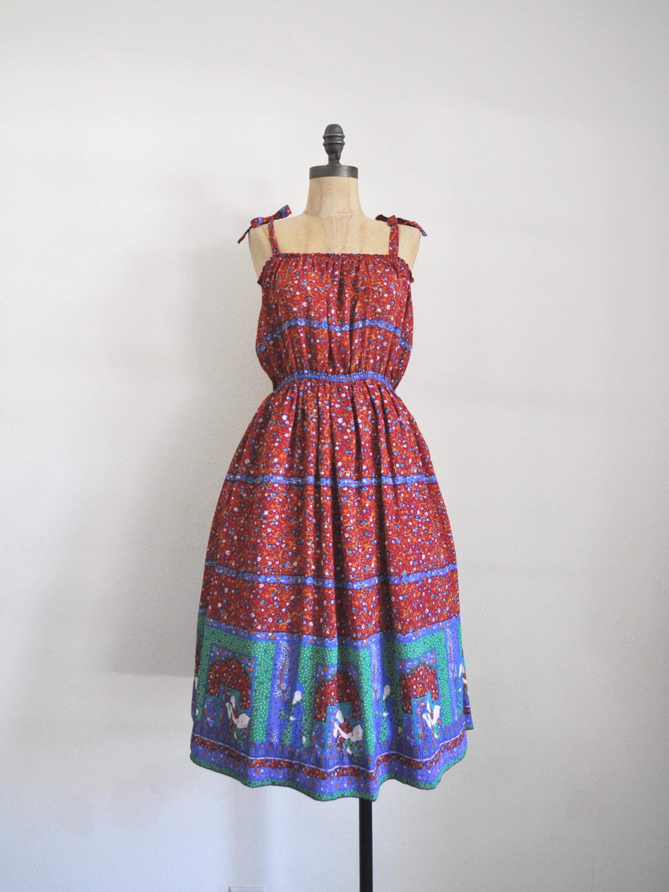 🩷SOLD🩷Red chiffon novelty print sundress. Adjustable shoulder straps, pull over, elastic on the bust and waist. Bust: 36” Waist: 22-38” Length: 42” Shoulder to waist: 15” Hips: 52”