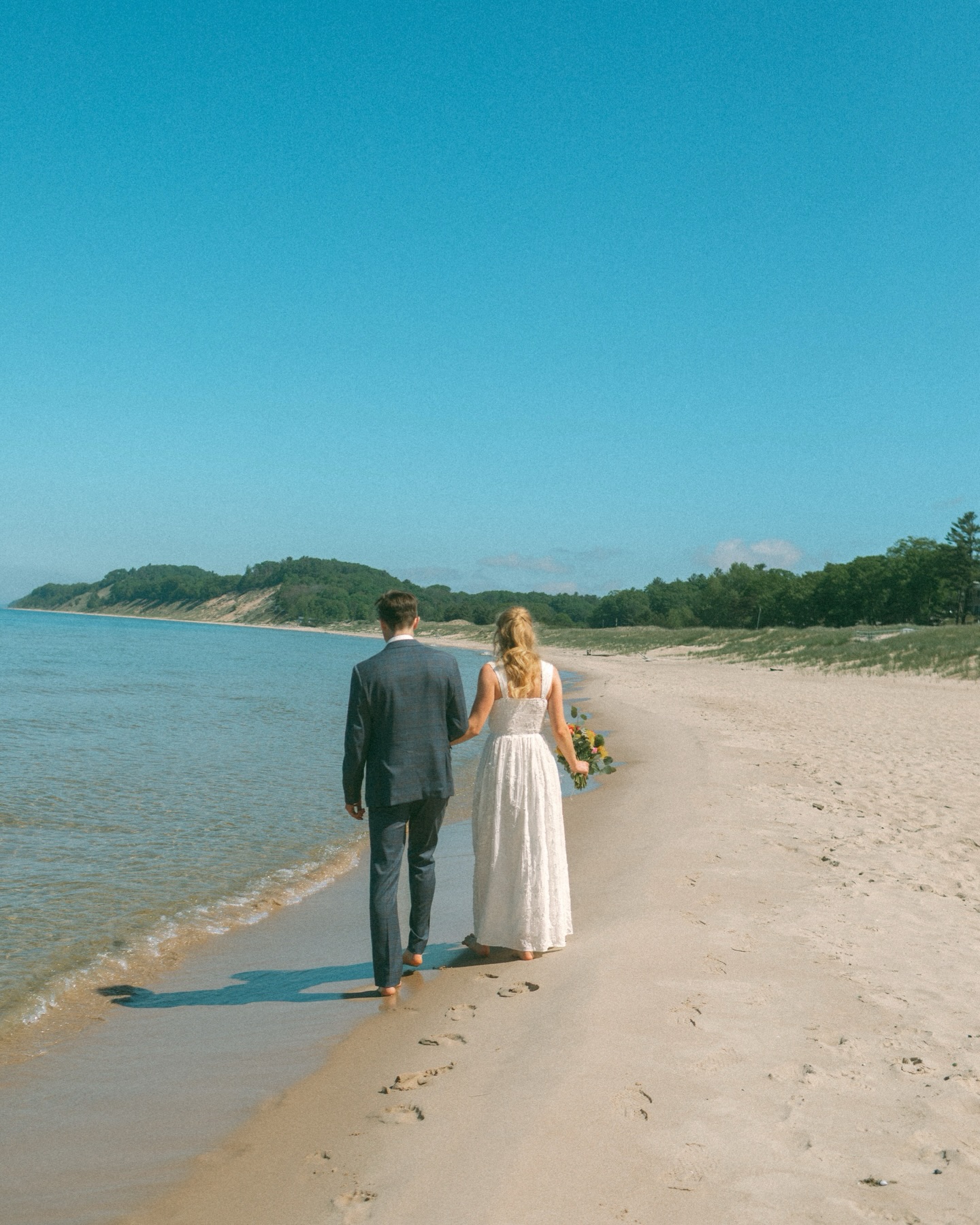 Some wedding days are loud. This one was quiet, intentional, and full of the people who matter most.
On an 80-degree day with a light breeze and full sun overhead, these two promised forever surrounded by their closest family along the shoreline. The kind of day that reminds you weddings don’t need hundreds of guests to feel significant…they just need love, presence, and people who truly know your story.
We started at the beach, where tears mixed with laughter and sunlight danced across the water. Then we ended the evening gathered around a table at a local vintage restaurant, sharing stories, hugs, and the simple joy of being together.
I leaned into a film-inspired edit for this gallery…soft, nostalgic, and imperfect in all the right ways. It felt fitting for a day that wasn’t about trends or production, but about connection.
A beautiful reminder that sometimes the smallest celebrations leave the biggest mark. 🤍