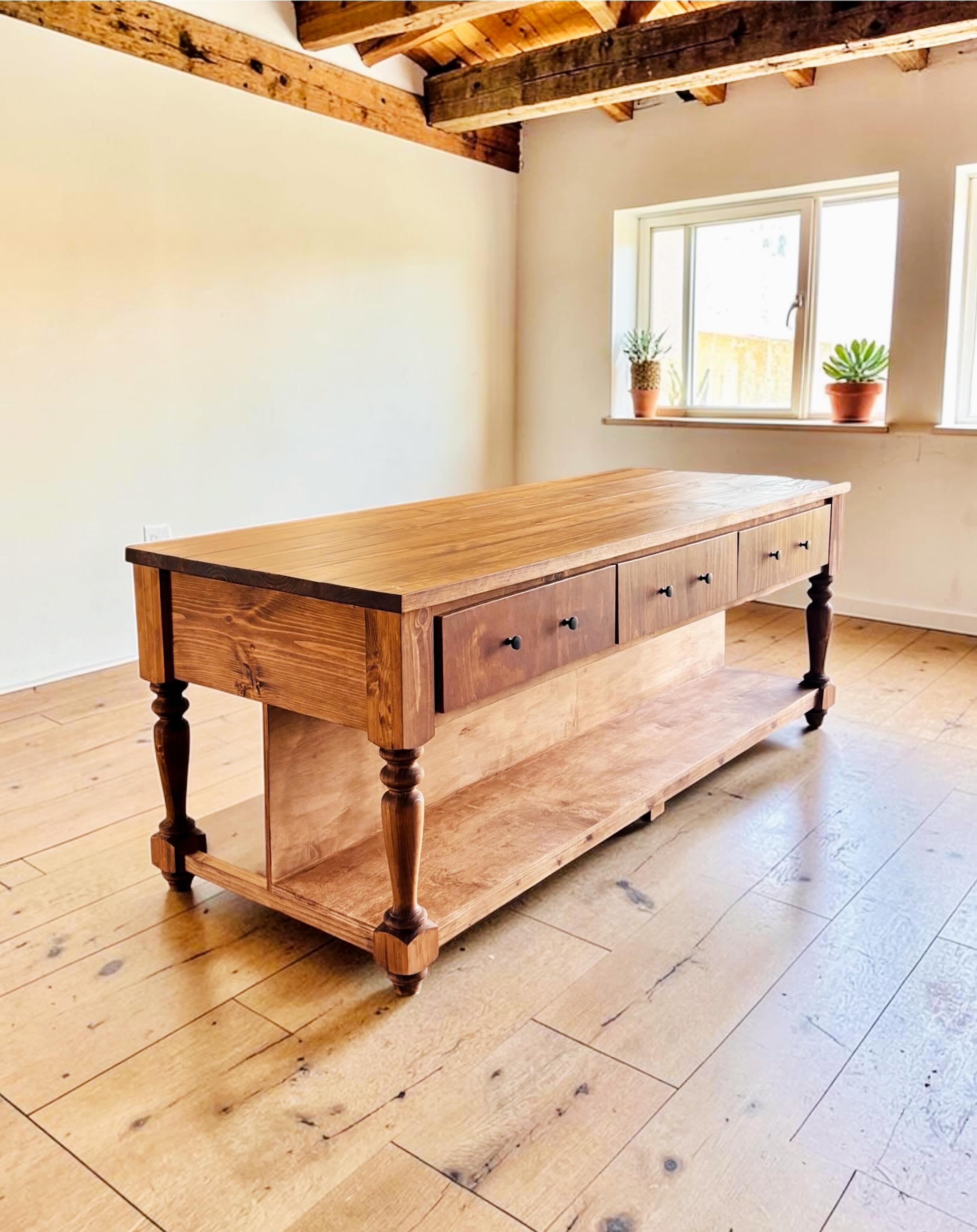 Our Homestead Kitchen Island is a client favorite - it has everything you need! Seating on one side, drawers, divider and shelf 😍