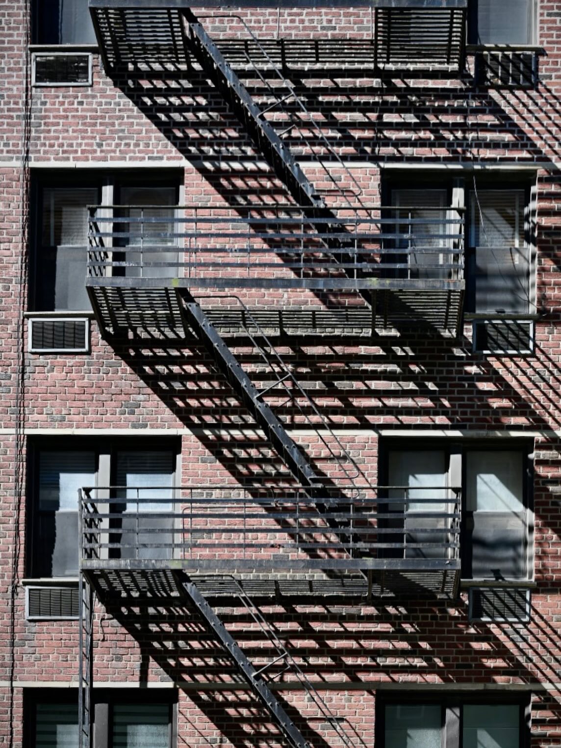 Walking around #NYC this morning after having a bialy and loving the fire escapes especially in the morning sunlight. #shadows