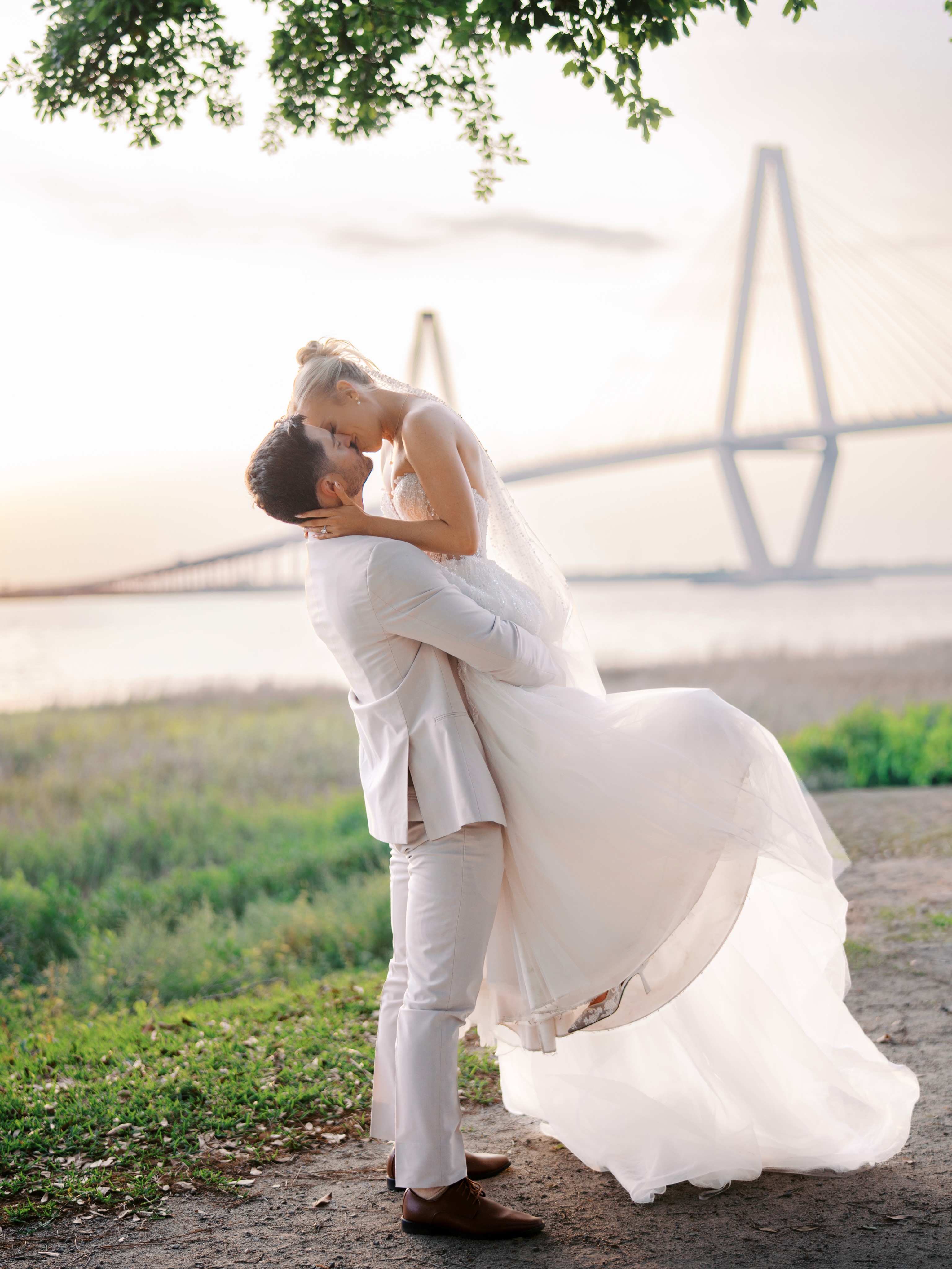 There’s nothing like a sunset view with the Ravenel, and Harborside East is the perfect venue for just that.
Whether you’re planning a wedding in downtown Charleston, one of our many beaches, or across the tri-county area, we are here to make sure your dreams come to life for the perfect day.
To work with our wedding planning team, visit us at directmydaycharleston.com.
-
Wedding Planner I @calhrhodeevents, @directmydaycharleston
Assistant Wedding Planner I @bridgettecatherallweddings , @leilakrebs
Bar I @brandbarsandevents
Bridal Bouquet I @coastalcreationsfloral
Catering I @charlestoncateringandevents
DJ I @djsof843
Hair/ Makeup I @lashesandlacechs
Photography + Videography I @carolinapalmsphotography
Rentals I @eventworksrentals
Transportation I @charlestonblackcab
Venue I @harborsideeast
Shelby I @shellbeestewart
Jacob I @freezeunit11