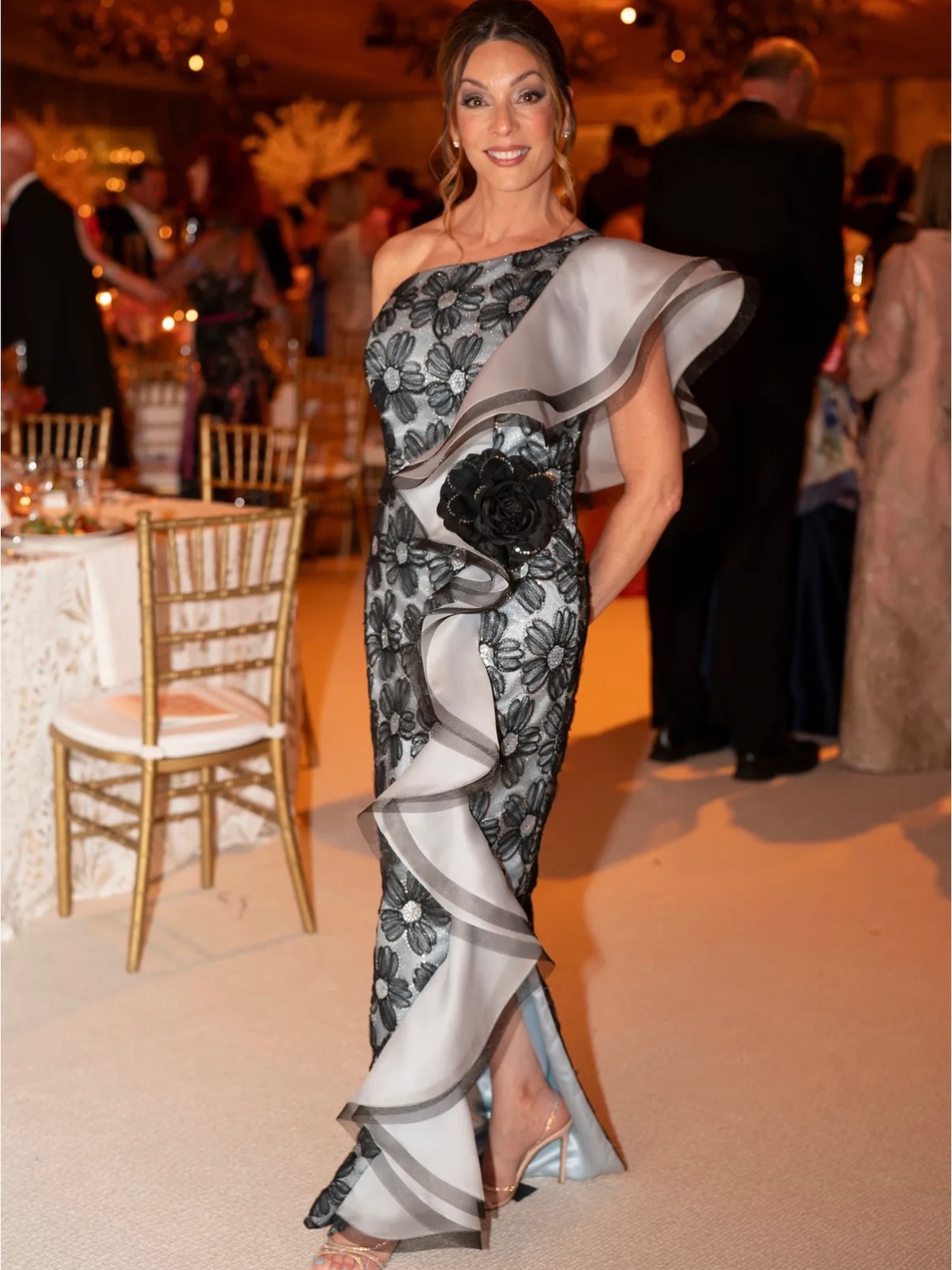This gorgeous client was an absolute vision in Nashville, wearing a one-of-a-kind custom gown by Paula Varsalona NYC.
This show-stopping couture creation features intricate black floral embroidery layered over a subtle, sophisticated metallic net and satin, in a custom silvery ice-blue color, all beautifully framed by a dramatic architectural ruffle of silk organza and trimmed with a delicate horsehair.
Pure elegance from NYC to Nashville.
#customdesign #paulavarsalona #nycdesigner #bespokefashion