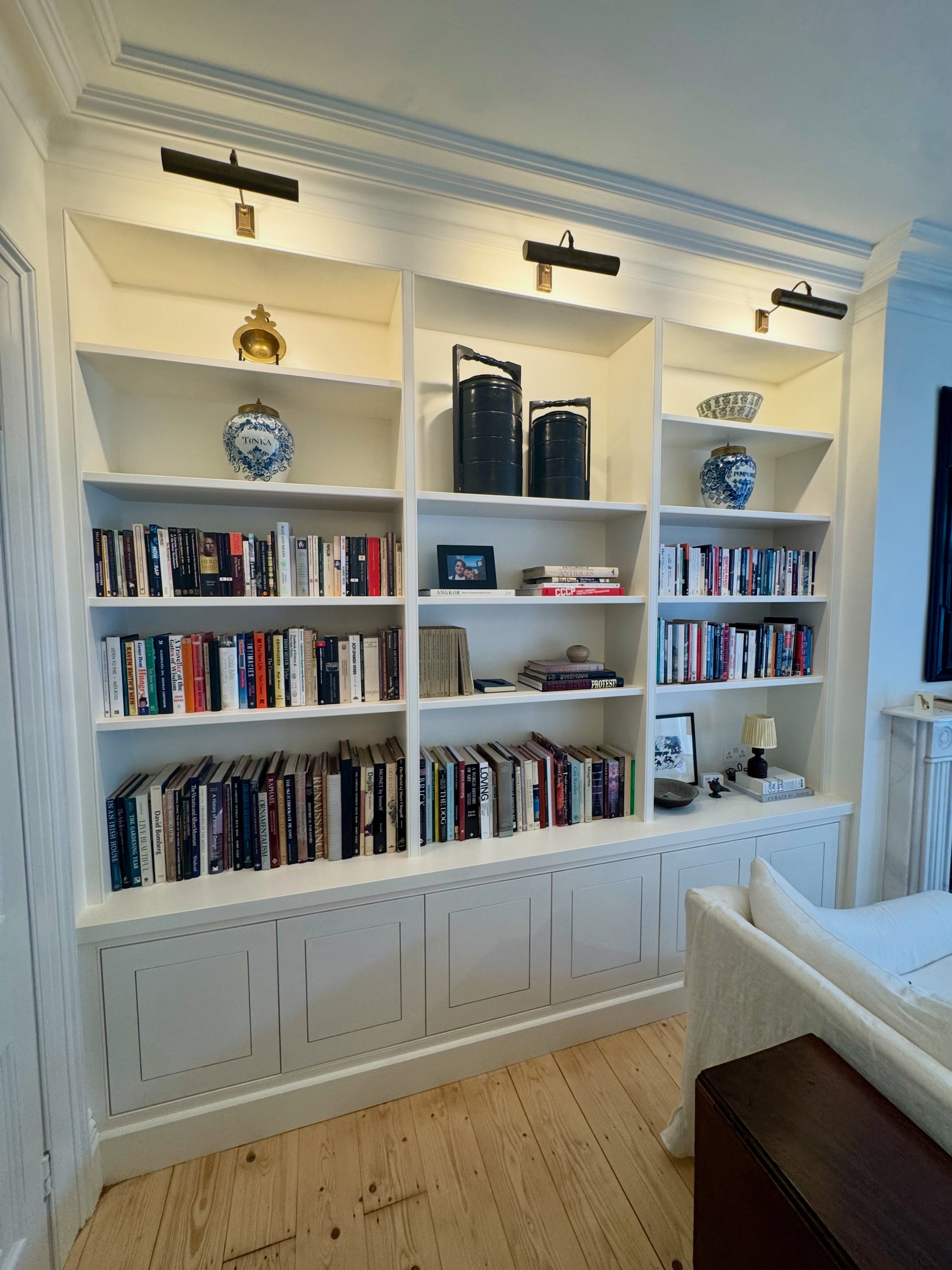 Some photos of a project that Matt and I built last year. Looking lovely all painted up and filled with stuff, love the little details like the lights and the doors too. Lovely stuff #carpentry #bespoke #storage #bookcase #joinery