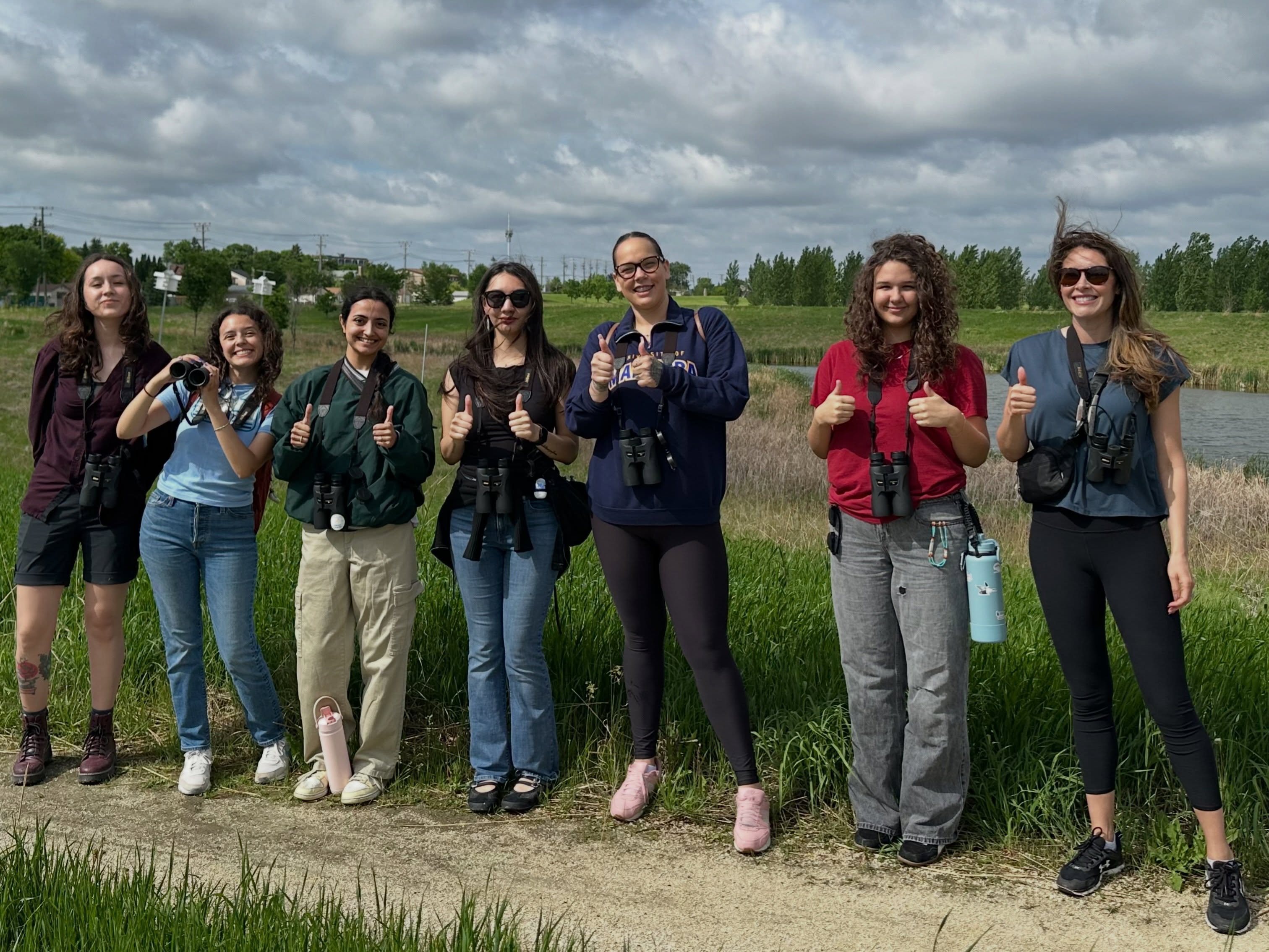 On June 10, we hit the trails with the amazing birders from the Indigenous Student Summer Internship Program (ISSIP). We found so much bird joy right here on the Fort Garry Campus! Highlights included Eastern Bluebirds, an Osprey, and a female Hooded Merganser.
It was a good day to be Indigenous and a great day to be birding together.
Our next birding walk is June 16. We hope to see you there!
Slide 1. A group of Indigenous birders posing for a photo in front of a pond.
Slide 2. A male and female Eastern Bluebird pair at a nest box. The female is holding some grasses in her bill.
Slide 3. An American White Pelican.
Slide 4. A Mallard mother with her ducklings.
Slide 5. An adult Canada goose with a gosling.
Slide 6-8. The checklist for our walk.
* Canada Goose
* Wood Duck
* Mallard
* Hooded Merganser
* Sora
* Killdeer
* American White Pelican
* Osprey
* Swainson’s Hawk
* American Crow
* Tree Swallow
* Purple Martin
* Eastern Bluebird
* American Robin
* House Sparrow
* Chipping Sparrow
* Savannah Sparrow
* Song Sparrow
* Western Meadowlark
* Red-winged Blackbird
* Common Grackle
📷: @justinleerasmussen
@umindigenous