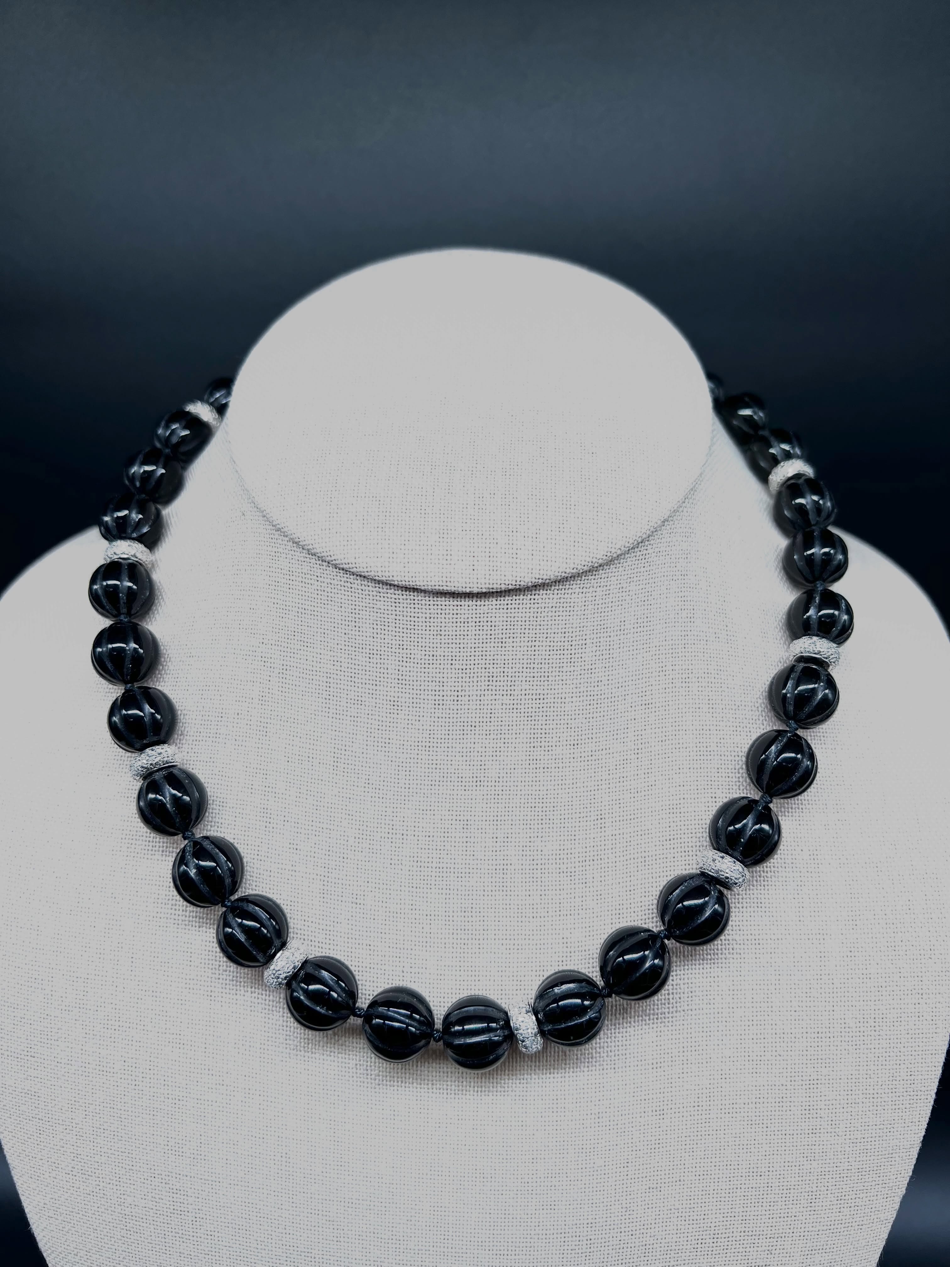 This striking necklace pairs richly carved black onyx beads with sparkling diamond-set spacers, all beautifully accented in luxurious 14K white gold. The dramatic contrast between the deep, glossy onyx and the brilliance of the diamonds creates a timeless statement piece that transitions seamlessly from day to evening.
A sophisticated addition to any jewellery collection, this necklace offers both modern glamour and classic appeal.
🖤 14K White Gold
🖤 Carved Black Onyx Beads
🖤 Diamond Accents
🖤 Timeless Statement Design
Available at Martine Boré Antiques.
#OnyxNecklace #DiamondJewelry #WhiteGoldJewelry #EstateJewelry #FineJewelry LuxuryJewelry VintageJewelry JewelryCollector StatementNecklace BlackOnyx DiamondDetails ElegantStyle MartineBoreAntiques JewelryLover TimelessElegance AntiqueJewelry EstateFinds VancouverJewelry WestVancouver ShopLocalLuxury