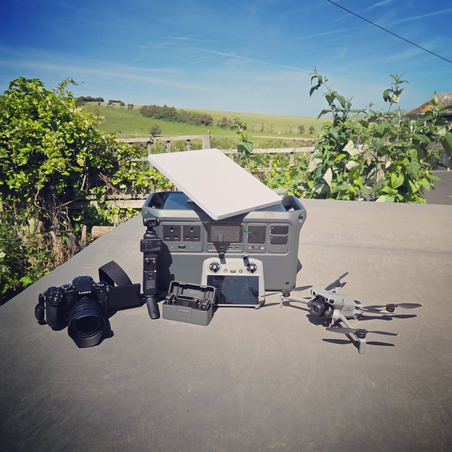 Only thing not in the photo is my laptop...because it's busy working!
With the nicer weather coming in now, we're getting busier and busier!
In the photo you'll see our starlink mini for instant Internet access wherever we are. Sitting ontop of our power station 1000 V2 providing continous power whatever the need, surrounding this is our mini 5 pro raring to go, our osmo pocket 3, dji microphones and our Panasonic Lumix Mirrorless DSLR DMC-G60 camera.