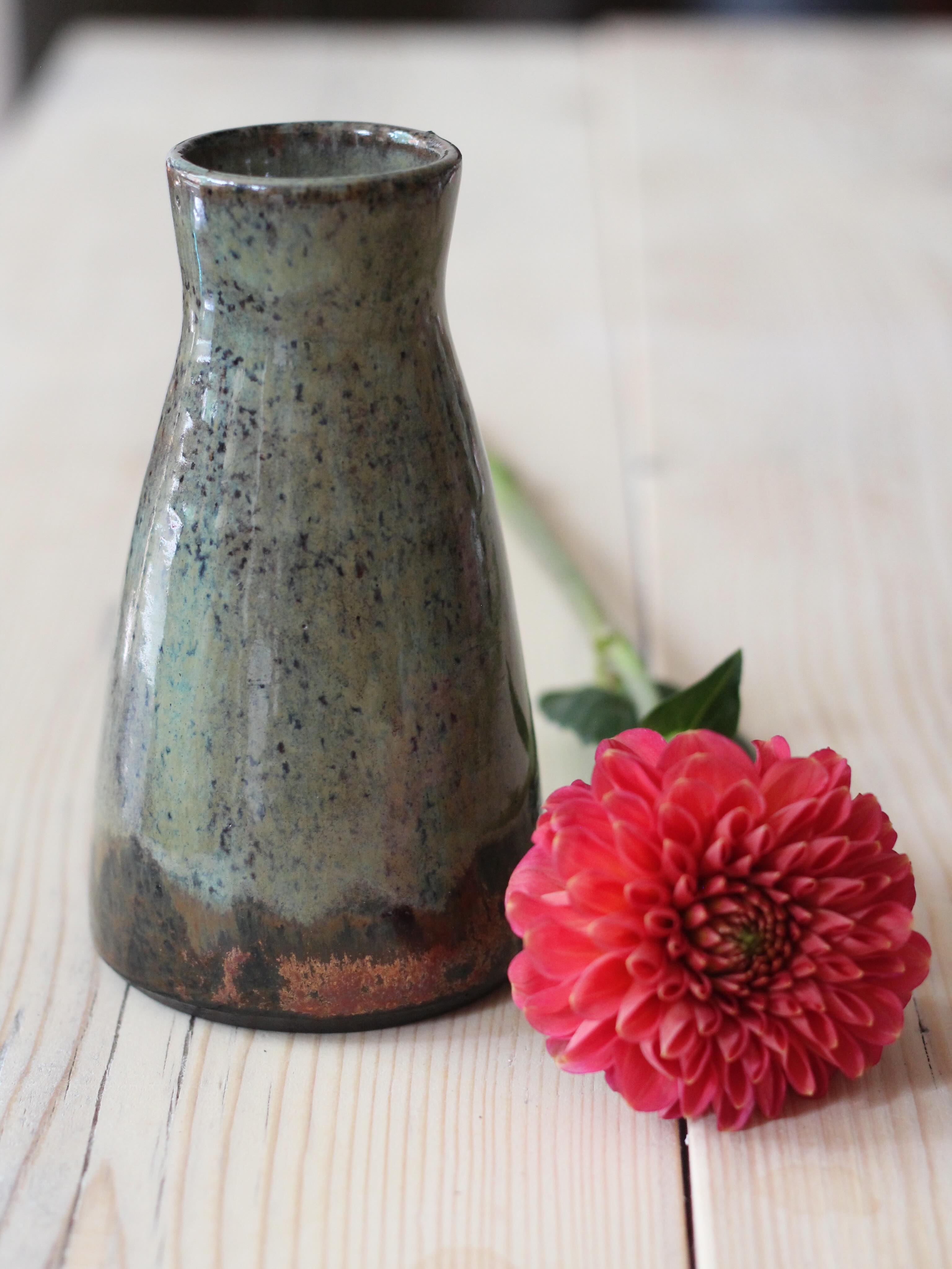 I still cannot get enough of this copper glaze. This is my green landscape colour way, and i have a good stock of vases in my shop currently #jenmakespots #dahlia #copperobsession #handthrownvase #bristolpotter