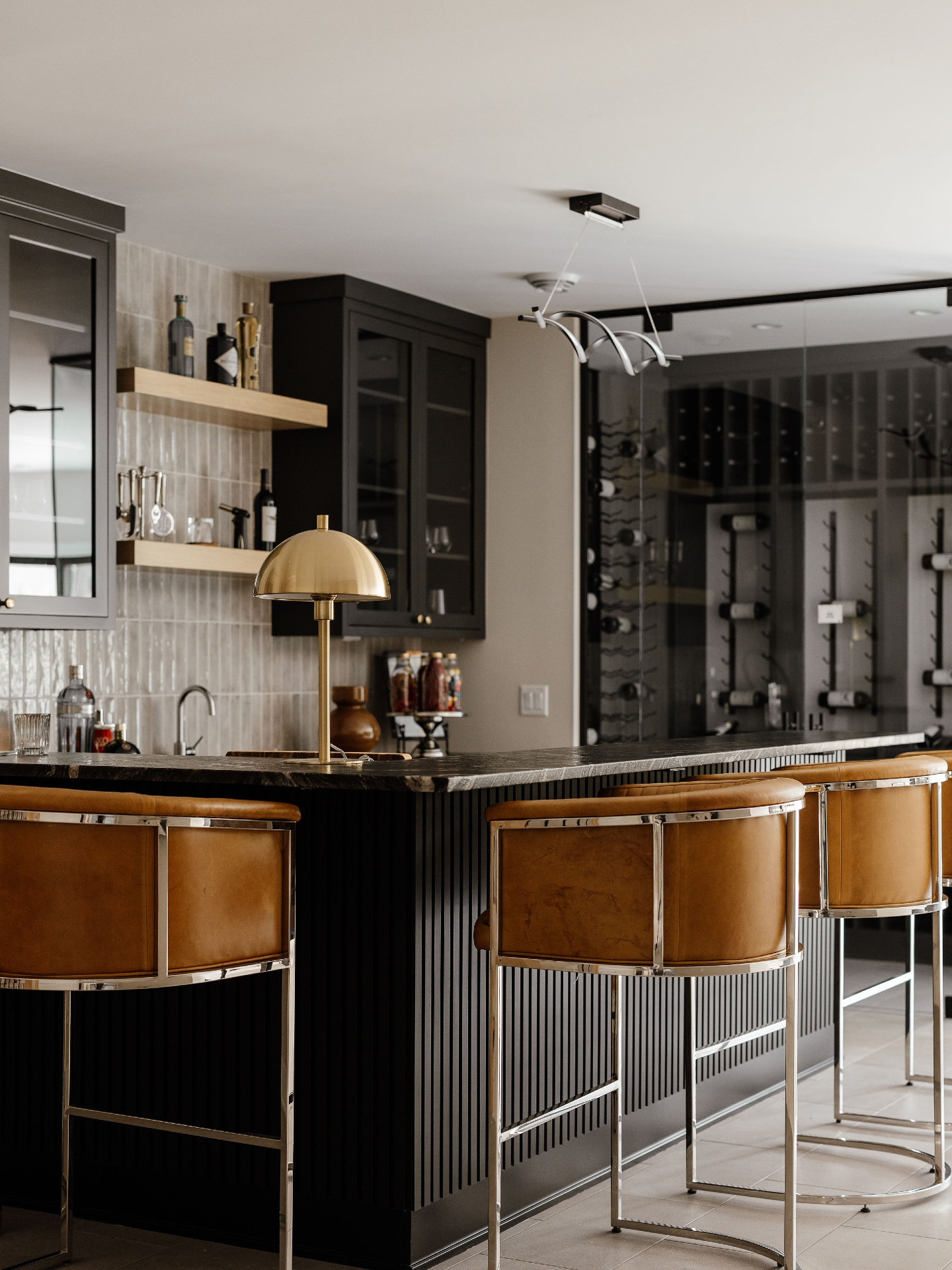 A moody bar right in your lower level 🍸
There’s so much to love in the McGuire Road bar, from the leather barstools to the walk-in wine room.
Which detail is your favorite?
#mhd #lovelyliving #homebartender #custombar #custombars