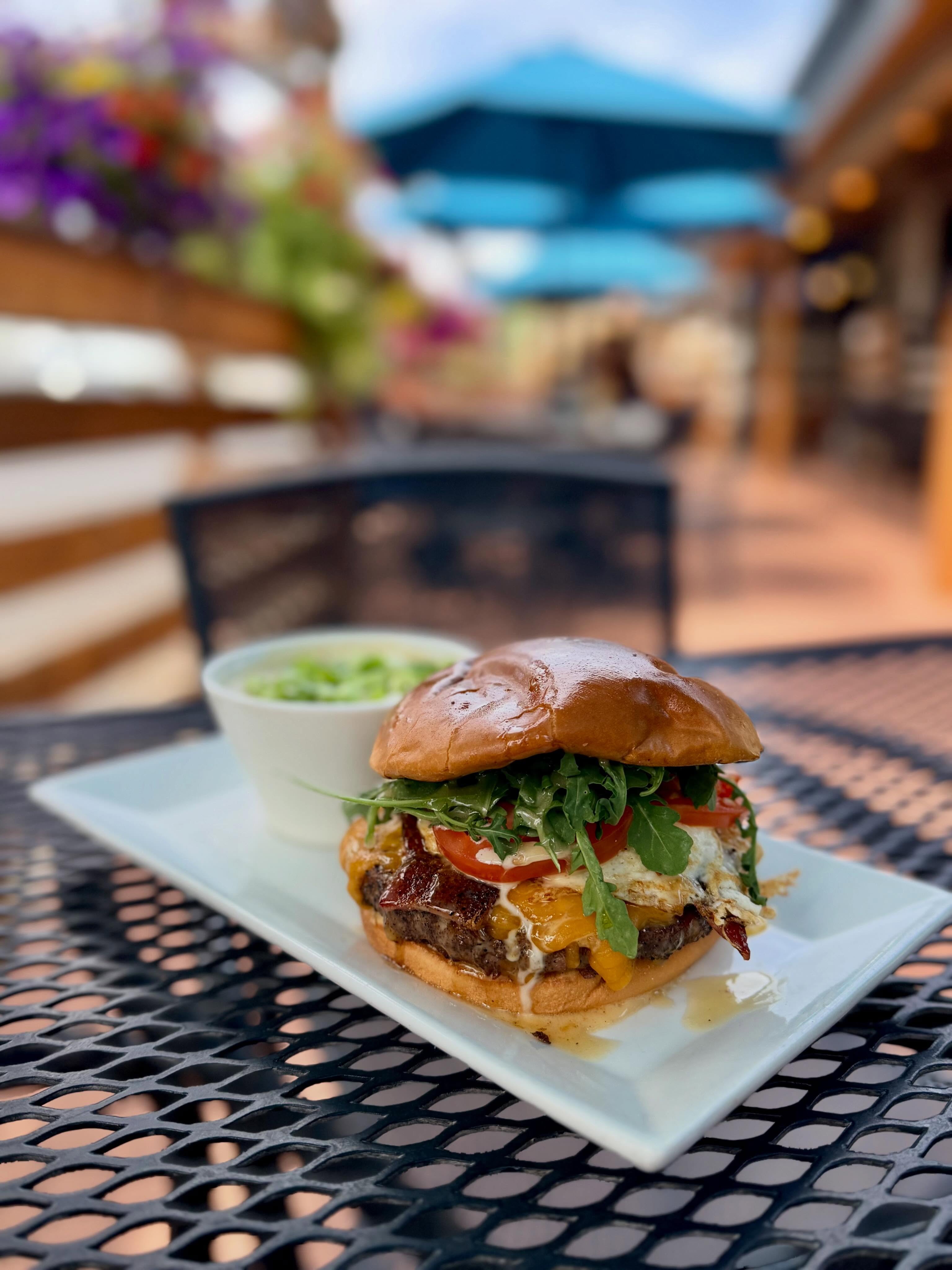 Weekly specials so good you will climb mountains to enjoy them. Greens ones of course.
-
Weekly Specials: June 15 - June 20
-
Specialty Burger: Maple Brunch Burger
Grilled beef patty, cheddar cheese, peppered bacon, fried egg, arugula, tomato and Vermont maple aioli on a toasted bun
-
Daily Soup: Chef Tay’s New England Clam chowder topped with green onions
-
Lunch Special: The Green Mountain Melt
Warmed sliced turkey, cheddar cheese, sliced granny smith apples, arugula, tomato and whole grain honey mustard on toasted sourdough
-
Birch Salmon: Grilled, topped with a Vermont maple-mustard cream sauce
