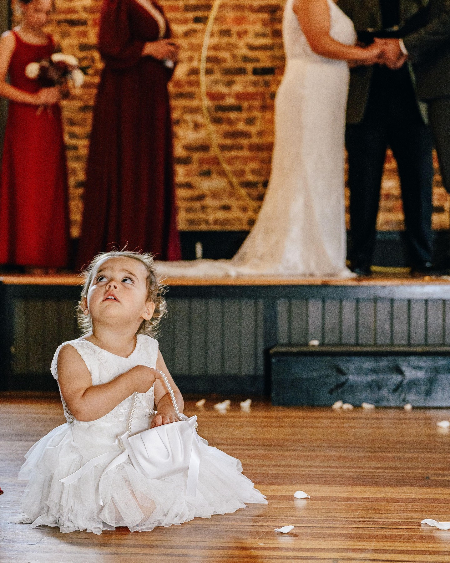 When the flower girl steals the show. Honestly, some of our favorite moments happen when we're not even looking. The candid stuff? That's the gold. 📸