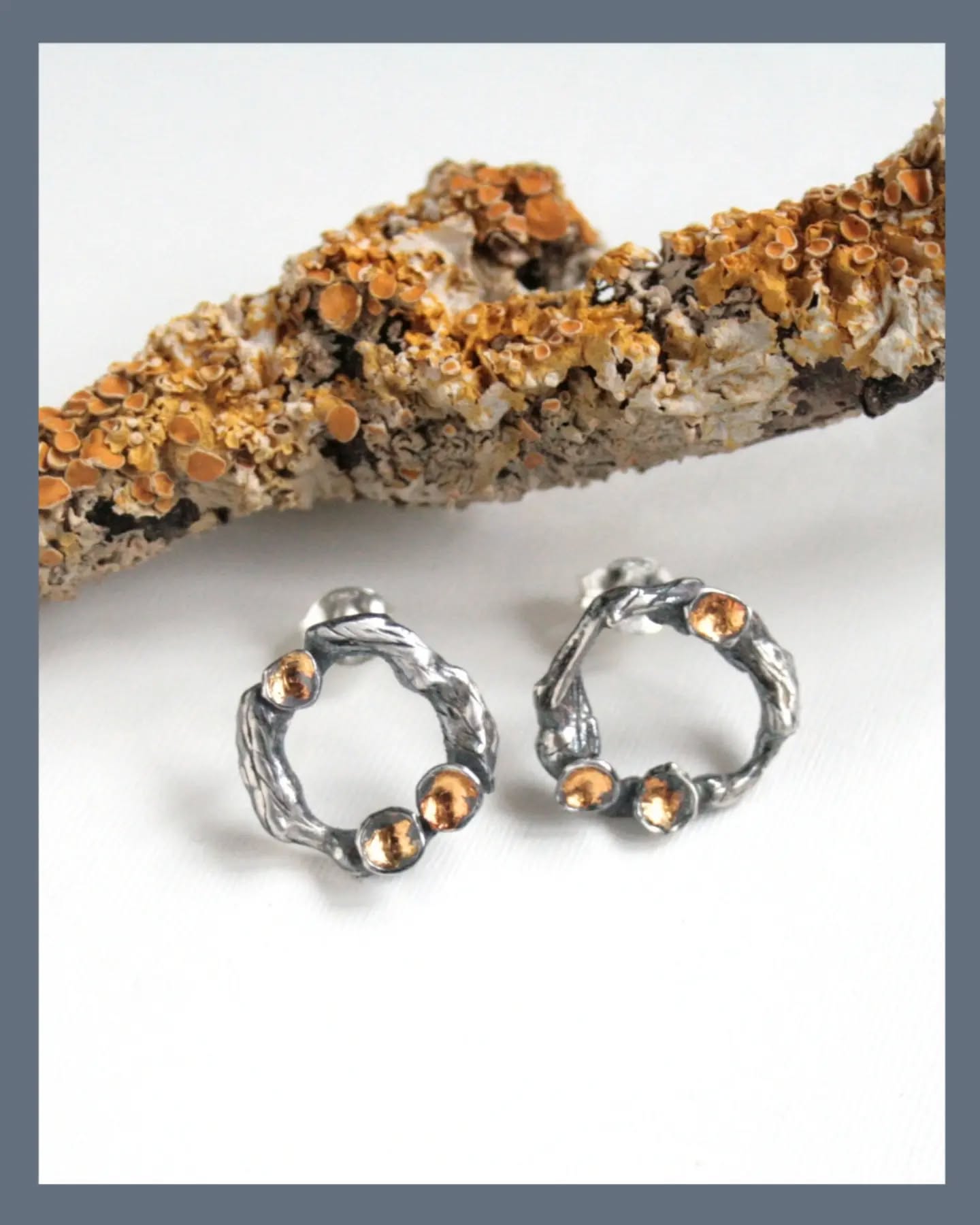 Lichen is one of my favourite sources of inspiration.
These earrings are twigs hoops with a few pieces of lichen growing on them.
I've applied 24ct gold foil to the lichen and darkened the surface of the silver.
They're a beautiful way to add a touch of nature to an outfit and hopefully will remind the wearer to slow down and pay attention to nature all around them.