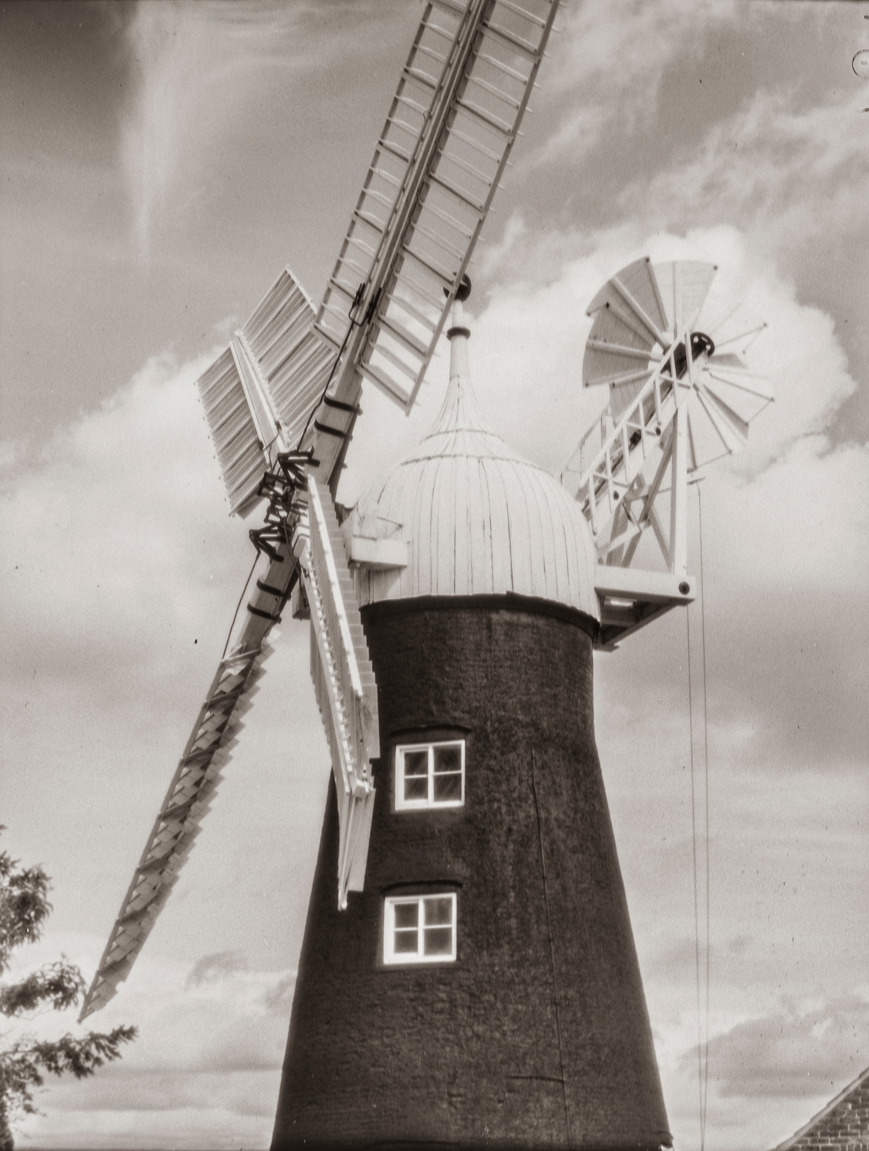 North Leverton Windmill captured on a 100 year old camera.. Originally the windmill was built with a lower tower to enable the common sails to have the cloth put on from the ground. A major refit in 1884 lifted the tower several feet, and new patent sails were fitted.
The Houghton Post-card camera is therefore of a similar era to the Windmill’s present form. The camera is new to me and I have some work to do to get the most out of it. With the current lens, an Aldis f7.7, the bellows don’t extend enough when focussed and this restricts the image coverage of the film. Hence the windmill is cropped at top and bottom - I will return and try again - and buy more lovely fresh milled flour!