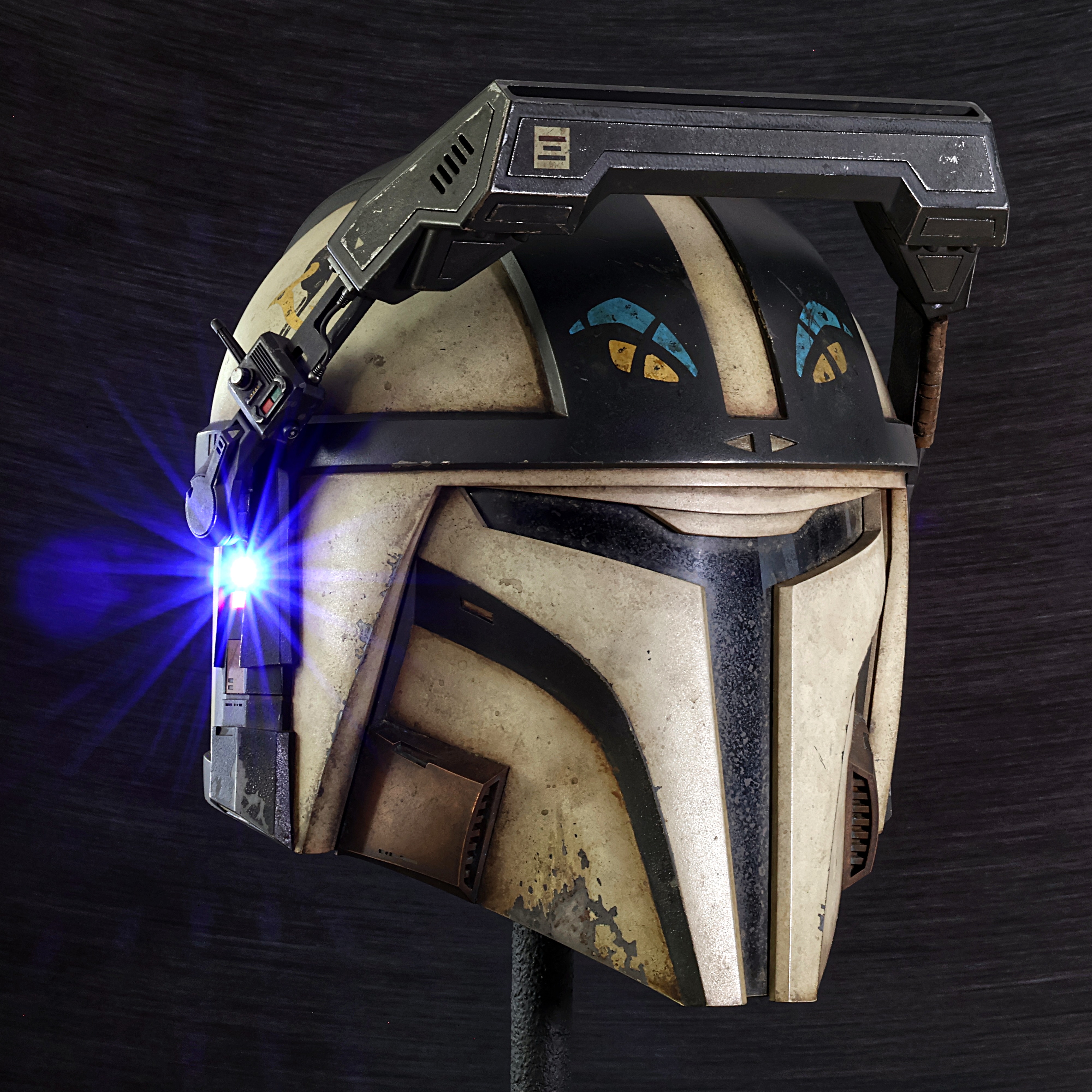 New helmet completed for a client! Helmet in-universe background story:
‘The outpost sat about fifty meters down inside the canyon, and from his position atop the cliff, the Mandalorian had the perfect vantage point to eliminate his target. He crept closer to the edge, crouching behind a boulder. Lowering his MHAS macrobinoculars into place, he slowly raised his head and peered over the rim.
The outpost looked deserted. Through the heavily filtered, magnified display, he scanned across the terrain, searching for any sign of movement. Nothing.
There was a flash of light in the lower left corner of his display, and an instant later, something slammed into his helmet with a violent crack.
The impact snapped his head sideways and nearly tore the helmet from his head. His HUD erupted into static, flickering in and out as warning messages flashed across his vision. A red indicator light on the left side of his helmet began to blink furiously, signaling critical damage to the targeting system.
The Mandalorian dropped back behind the boulder and sat motionless for a moment. A faint grin crept across his face.
“Alright,” he muttered. “Maybe he’s not as dumb as I thought.”
He performed a function test on his rifle.
“This just got a lot more interesting.”’
==//==
Client wanted a custom paint job based around the concept provided by @skap_art (see last photo).
Helmet is my “Recon V2” model made from slush-cast polyurethane, the outer surface of which is infused with aluminum powder which allows me to create realistic metallic surfaces without painting it to look like metal (process called cold-casting).
The macrobinoculars are printed resin/PLA/ABS construction, with Alumaluster by @imperialsurface providing the shiny metallic skin underneath.
Resin used for cold casting is Model-Pro Black by @specialtyresins
Thanks for looking!
#mynocksden #custompaintjob #mandalorianhelmet #starwarshelmet #propmaking
