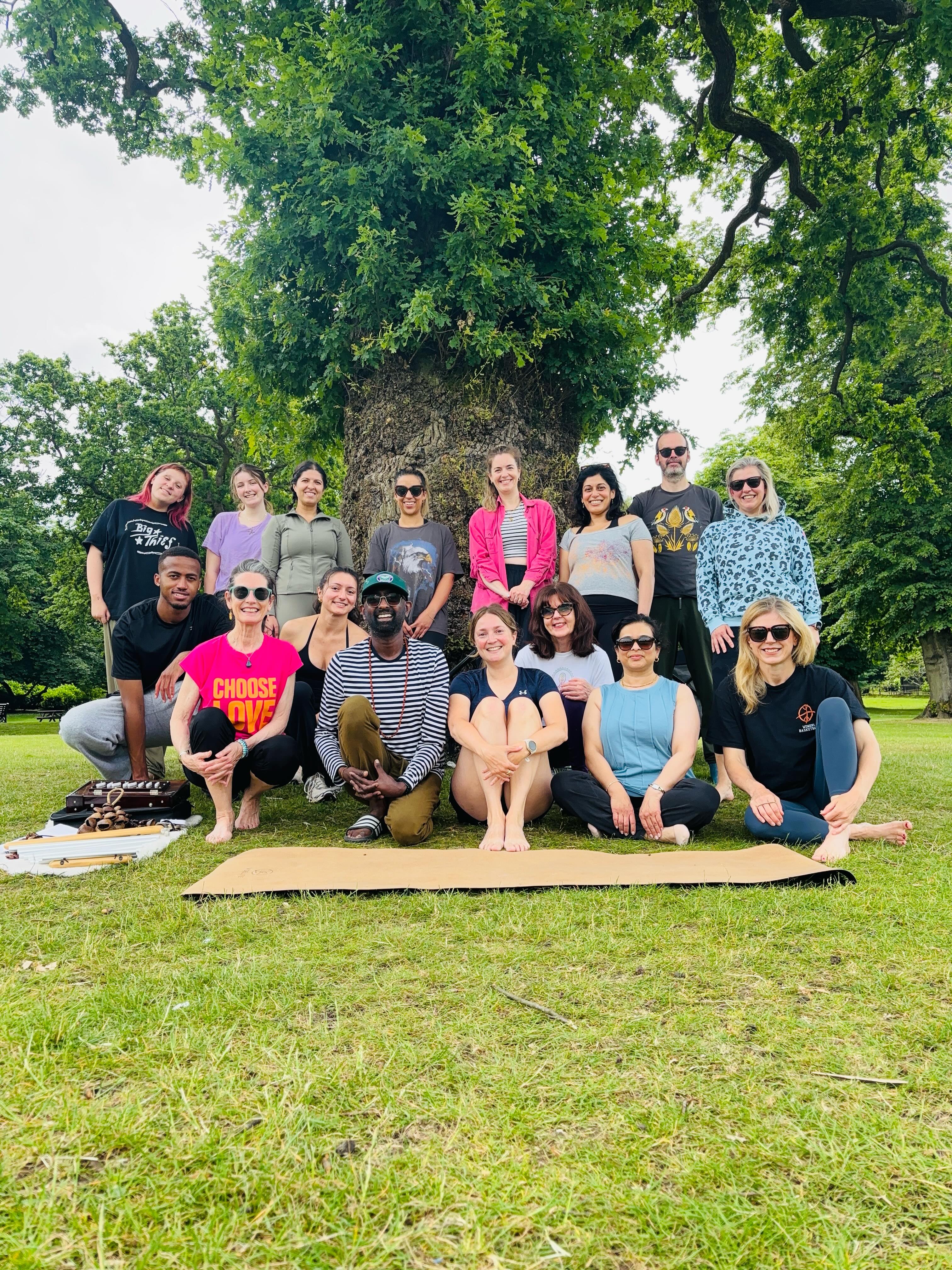 A day to celebrate and reconnect with community, nature and good conversation on a sunny morning in Cannon Hill Park!
We enjoyed a complete yoga class filled with mantra, pranayama, asana and plenty of yogic philosophy recognising the roots of yoga. What was beautiful to witness was the interest shown by the students and willingness to try these practices in safe environment.
Our reflection point was “what has yoga given to you?’ and we heard some deep and poignant shares about the impact this practice for India continues to improve their lives.
Of course we all deserve a post practice samosa and home made chai to keep the conversation going and nourish our bellies!
Thank you to all our guests for moving with me in the sunshine and giving so much effort in the session! I loved seeing you, meeting new people and reconnecting with people from across the years!
Keep a look out for more park yoga over the summer..
For we are the many.