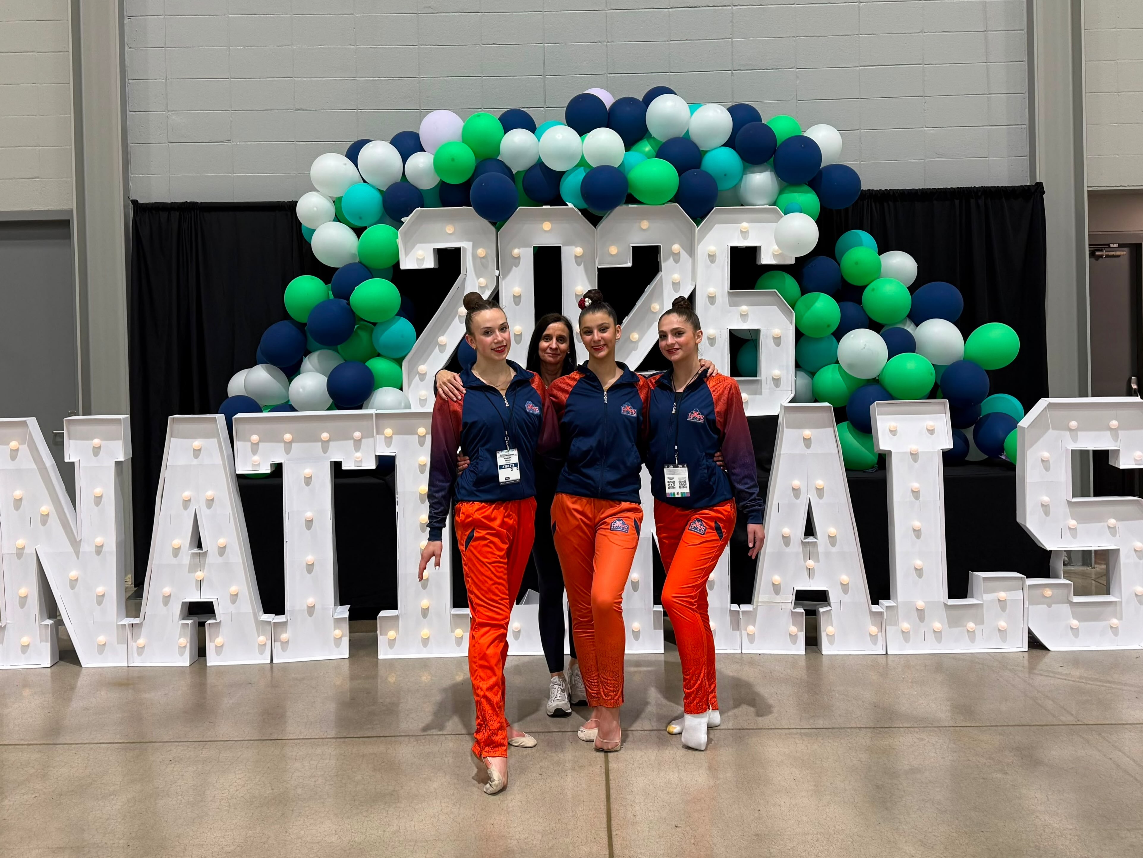 @usagymrg 2026 Nationals
Wrapping Up H.O.P.E. Rhythmic Team Final Season 🇺🇸🧡
As we close the final chapter of H.O.P.E. Rhythmic, my heart is filled with gratitude and pride.
Congratulations to our athletes who represented H.O.P.E. at the USA Championships:
Elisabed, Maria, and Penelope. You represented our program with determination, resilience, and class.
Thank you Coach Rocio for your support!
A special congratulations to our national medalists:
🥉 Elisabed – 4th Place, Ball (Junior 2011 Division)
🏅 Penelope – 6th Place, Ribbon (Senior 2010 Division)
As H.O.P.E. concludes its journey, we do so with a legacy far greater than we ever imagined.
In just a few years, a small nonprofit program built in facilities and training hours suited for an Xcel-level program achieved:
* State, Regional, and DVP National Champions
* USAG National podium finishes and medals
* FIG sanctioned international competition medals
* A FIG sanctioned European event finalist
* Two National Team members
* Representation at the Junior World Championship
These accomplishments were never supposed to be possible under the training hours and structure we had during key developmental years of our gymnasts. Yet our athletes, families, and coaches proved that passion, dedication, and belief can overcome limitations.
To every gymnast, parent, coach, volunteer, and supporter who was part of this journey—thank you. You helped build something truly special, and the legacy of H.O.P.E. will continue through every athlete whose life it touched.
One final competition. One final National. One incredible legacy. Forever H.O.P.E. 🧡