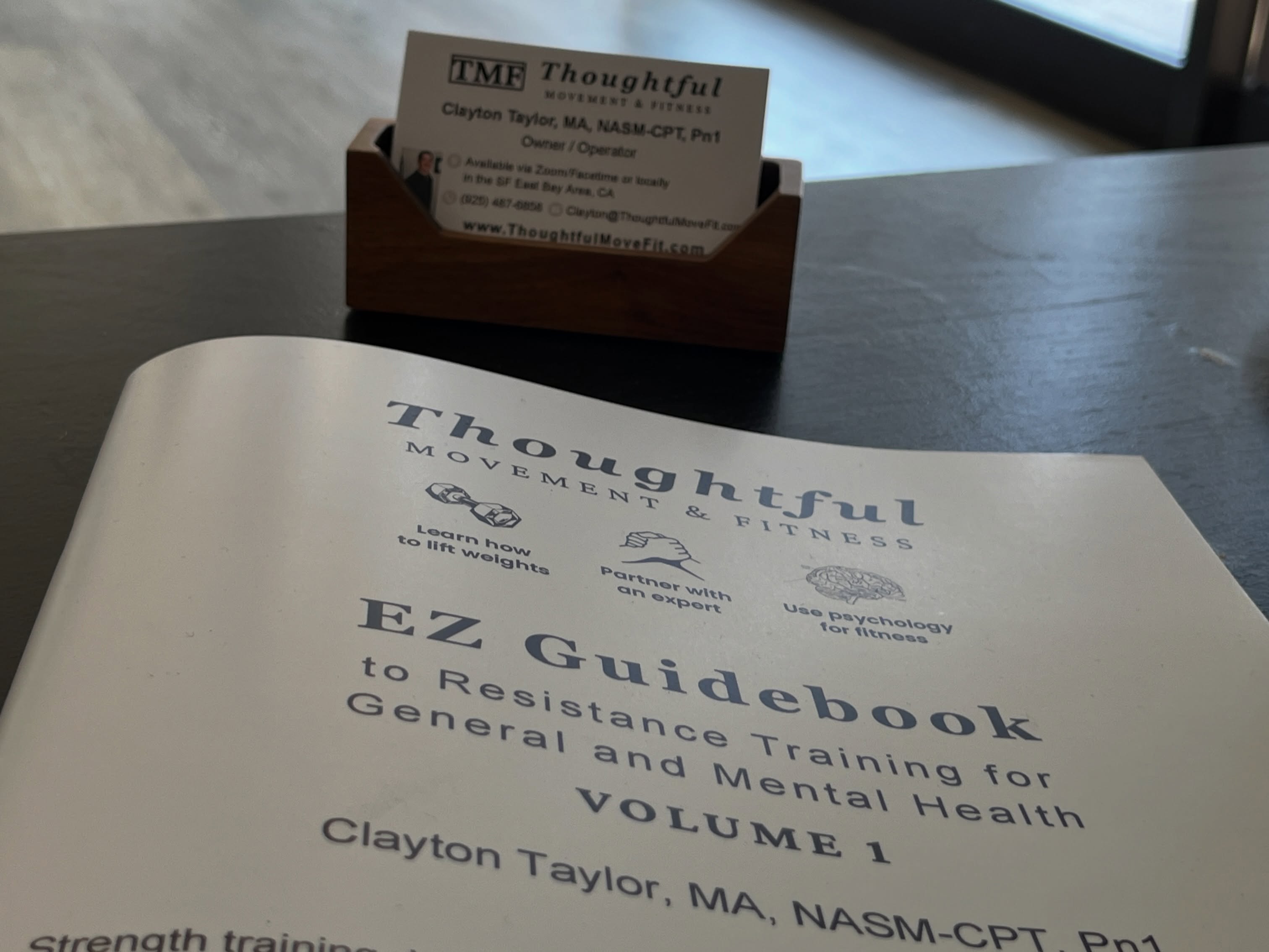 The TMF EZ Guidebook Volume 1 is available for purchase or free digital download at www.ThoughtfulMoveFit.com.
Check out how good it looks on that coffee table mmmhhmmmm yesssss we must haves it.