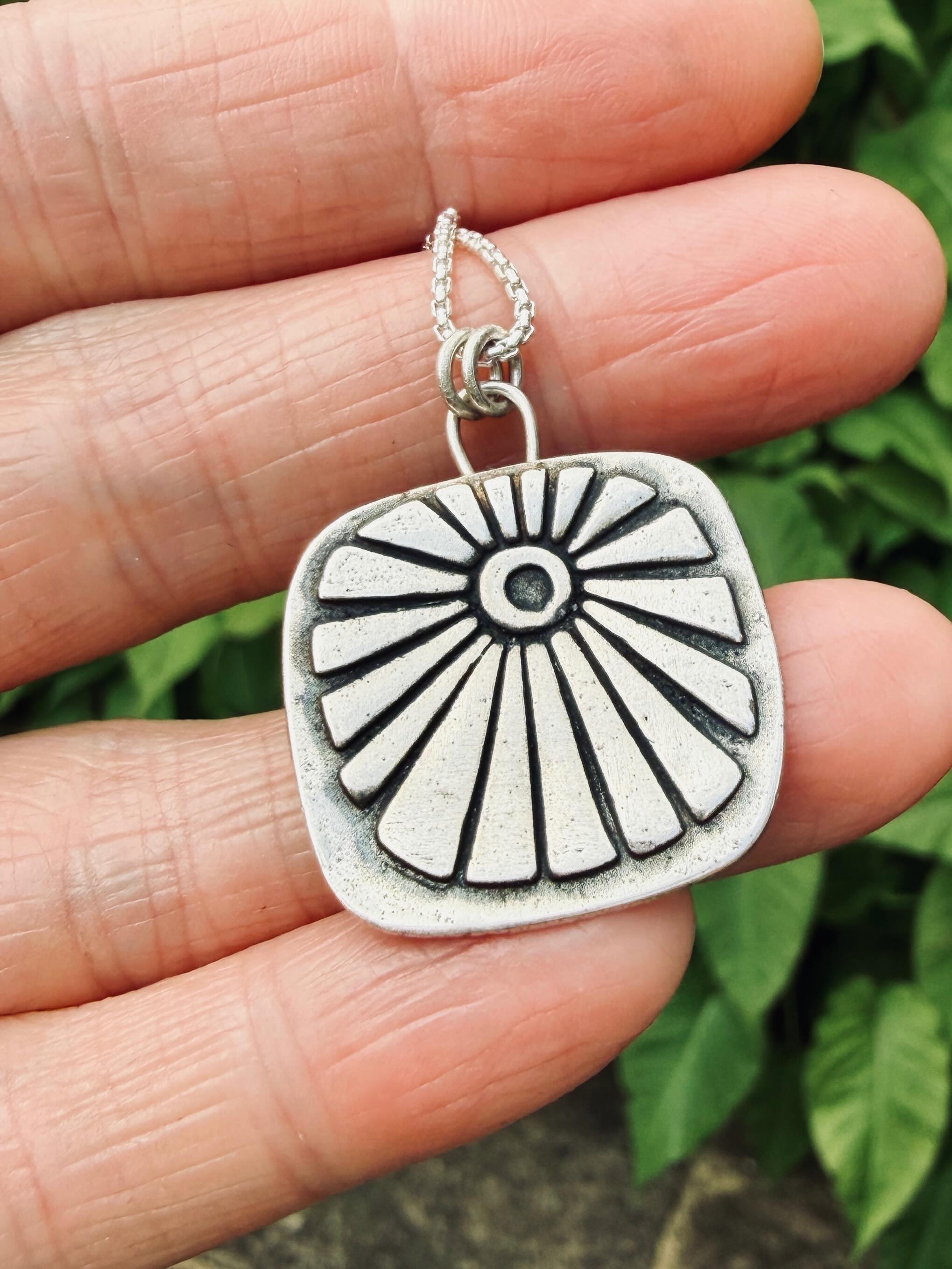‘Sol’
This necklace is designed for the sun seekers, barefoot wanderers, and those who find home beneath open skies...
This ‘Sol’ necklace is handmade from pure Silver with a raised surface that feels lovely and tactile. The pendant measures around 25mm and is a softly rounded, slightly wonky square shape!
🌞
