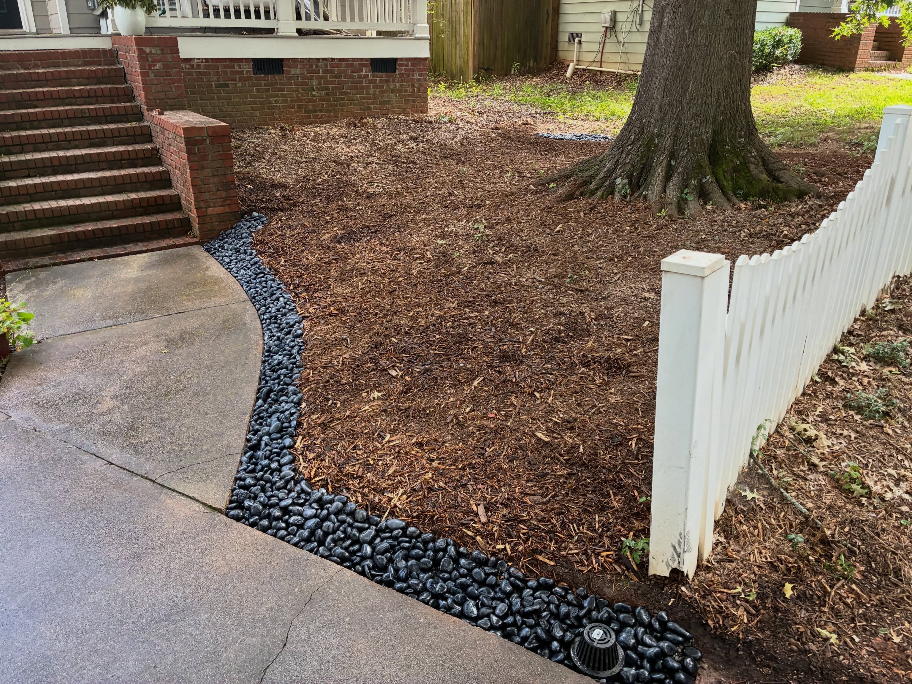 Little drainage installation we just finished up in the city. 12” @ndsdrainage catch basin, dual wall discharge lines, curtain drain by the sidewalk. With this project we were limited in what could be done because of that big beautiful tree but this system is awesome and going to completely solve these erosion issues for many years to come.
Swipe to see the initial problems.