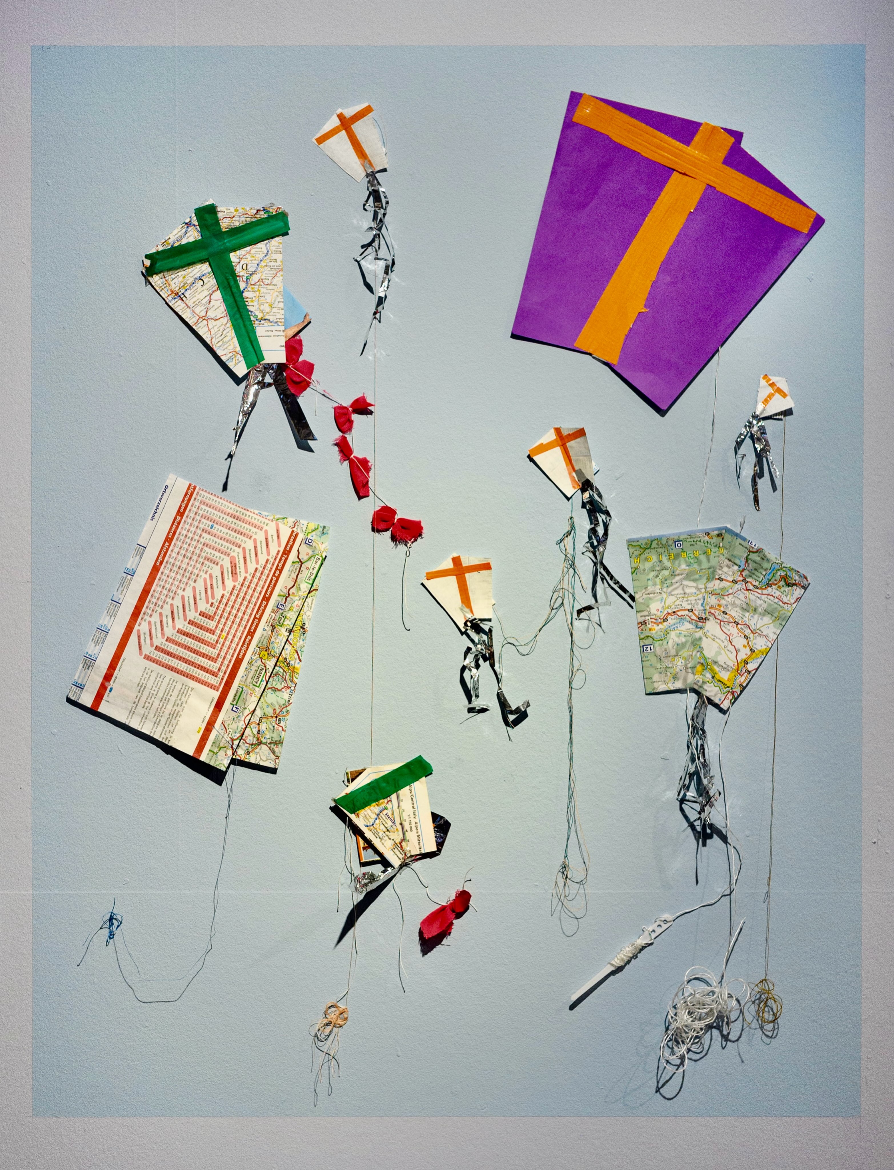 “COMMUNITY KITES”
2016 CALAIS / 2026 SWANSEA
We are delighted that “Community Kites” are currently exhibited in “ART IN THE SKY” @glynnvivian in Swansea curated by @isabelgriffin63
19.06.26 - 27.09.26
The origins of these 9 tiny kites are best described by the following text, edited from Art Refuge’s original Blog post from ‘The Jungle’ camp in Calais, 22.04.16:
“THURSDAY
We were once again struck by the challenges of location & structure of the Mêdecins du Monde psychosocial area which sits in the the camp’s south at the road’s edge, doors open to the spacious tent but fenced off to the ‘wasteland’. Throughout the 5 hr session the space was mostly visited by Afghani men & teenage boys newly arrived to Calais, as well as some young men from Sudan. Kite-making, marking routes on the large map & images of home, dominated the session.
Several men communicated fragments of their journey, such as the terrifying boat trip from Libya, one man describing being in water for hours before being rescued. The map & mapping once again offered a valuable tool for marking out these journeys at people’s own pace, some spending hours in the space before making anything at all. A kite made out of a map of France flew beautifully until crashing back onto the ‘wasteland’.
FRIDAY
Many people from yesterday joined the @hummingbird.refugee.project space. This was a session for literally tying & untying knots. Kite making & attempts at flying were today’s main themes, complicated by spiralling winds, making a sustained soaring flight into the sky hard, but not impossible, to achieve…
Today’s kites made from road maps were the main activity led by men from Iran and Afghanistan – competitiveness giving way to collaboration. Small kites proved to work better whilst the larger kites got heavier – taped down, & struggling to fly much above the ground. The process of making involved building, cooperation, & absorption…
At the end of the day two boys joined us, one managing to fly a two stringed kite with skill & patience, their father looking on.”
#kitemaking #kiteflying #kites #calais #swansea