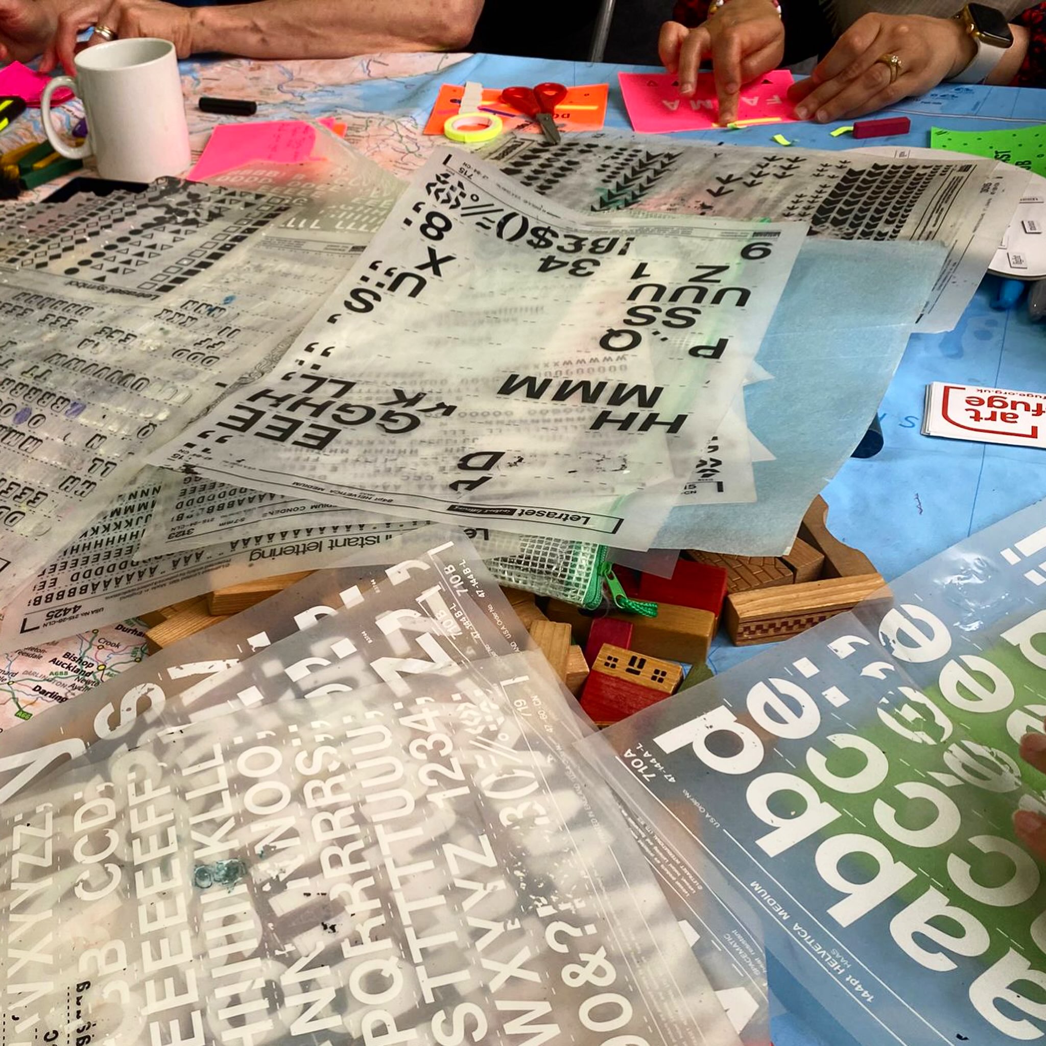 CIRCLES OF WOMEN
BRISTOL
29.06.26
For the second time this year, we were welcomed in to @aidboxcommunity ‘s women’s group, where each session begins and ends with all staff, volunteers and visiting organisations standing together in a circle to hear local news and updates at the start, and to gather thoughts and reflections on the session at the end.
At the larger of two tables, people gravitated towards using Letraset dating from 1976 to transfer their names, messages of hope and celebration on to fluorescent postcards, one being a birthday message that could be shared and passed through the community for whoever had theirs next.
Around an adjacent smaller table, patch repairs and new embellishments were made to the rug base that has visited several locations this year and has received contributions from around thirty children and adults. Many comments were made on the positive nostalgia offered up by the materials - that have travelled many miles - as we watched them being enjoyed five decades after their production.
#thecommunitytable #circlesofwomen #communityrugmaking #nostalgia #togetherwithrefugees🧡