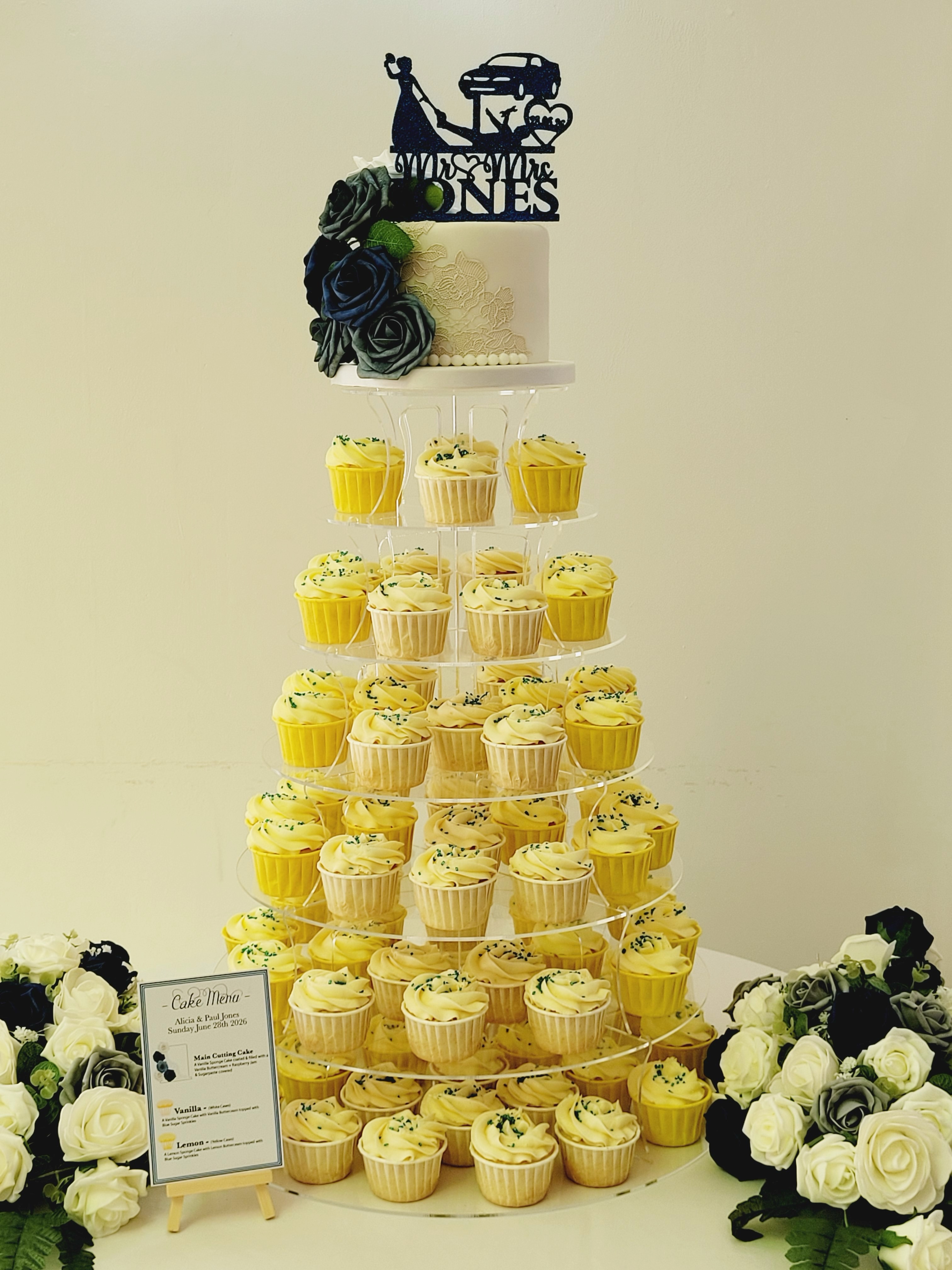 ✨ A stunning wedding cake display with a real wow factor! ✨
This elegant setup featured a beautiful lace-effect vanilla sponge top tier surrounded by 6 cascading layers of handcrafted lemon and vanilla cupcakes, creating the perfect centrepiece for a wedding celebration.
Set up at the beautiful @highfieldhall , this cupcake tower offered guests a delicious choice while making a breathtaking alternative to a traditional multi-tier wedding cake. The classic ivory finish, delicate lace detailing, and navy floral accents complemented the venue perfectly. 🤍💙
Planning your wedding? A cupcake tower with a cutting cake is a fantastic way to serve your guests, reduce waste, and create an unforgettable display that looks just as incredible as it tastes.
If you’re looking for a North Wales wedding cake maker who creates bespoke wedding cakes and cupcake towers, I’d love to help bring your vision to life.
💬 Which would you choose for your big day – a traditional tiered cake or a cupcake tower? Let me know below!
#northwalesweddingsuppliers #cupcaketower #lemoncupcakes #weddingcakemaker #weddingcakedesign