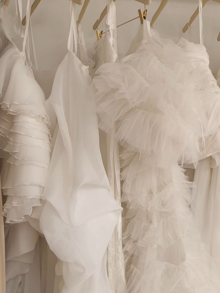 A weekend well spent at LOHO Bride. 🤍
Designer Ou had the pleasure of spending the weekend at our trunk show—walking through every gown with the @loho_bride team, training their talented stylists on the details behind the collection, and, most importantly, connecting with so many wonderful brides.
We can't wait to be back. 🤍
#OUMA #LOHOBride #LuxuryBridal #ModernBride #LuxuryWedding
One of the things that makes LOHO Bride so special is how thoughtfully curated the space is. Every designer is intentionally selected, creating an inspiring environment where brides can truly discover a gown that reflects their style.
A special corner at the entrance featured OUMA's zero-waste accessories, including our handcrafted headpieces and signature bridal bags. As a reminder, every bride who orders an OUMA gown during the trunk show will receive a complimentary zero-waste bridal bag, made from the leftover fabric from her very own wedding dress—a keepsake that's as meaningful as it is practical.
Designer Ou showcases the versatility of the Angelus Set, where the draped bodice detail transforms effortlessly into either an elegant neck scarf or a dramatic, extra-long train—allowing brides to create multiple looks from a single design.
The Alluvia Collection is inspired by the quiet beauty of the Danxia Landscape — its movement, softness, and ever-changing forms. Each gown balances sculptural draping with effortless elegance, creating modern silhouettes designed to move beautifully with every bride.
Thank you @christynbaird and the incredible LOHO Bride team for your warmth, passion, and care, and to every bride who visited and trusted OUMA to be part of such a meaningful chapter. Seeing so many brides fall in love with their gowns made the weekend unforgettable.