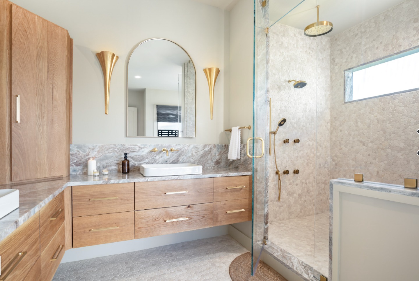 In this primary bath, summer is not just a season; it’s a feeling.
Designed for light, air, and ease, the space is wrapped in natural daylight that moves across every surface throughout the day. Soft reflections, warm textures, and a clean architectural palette create a retreat that feels both elevated and effortless.
This is where the day begins slowly and ends even slower.
#HGTVRockTheBlock #LuxuryBathroomDesign #PrimarySuiteDesign #ModernInteriorDesign #SummerHomeDesign