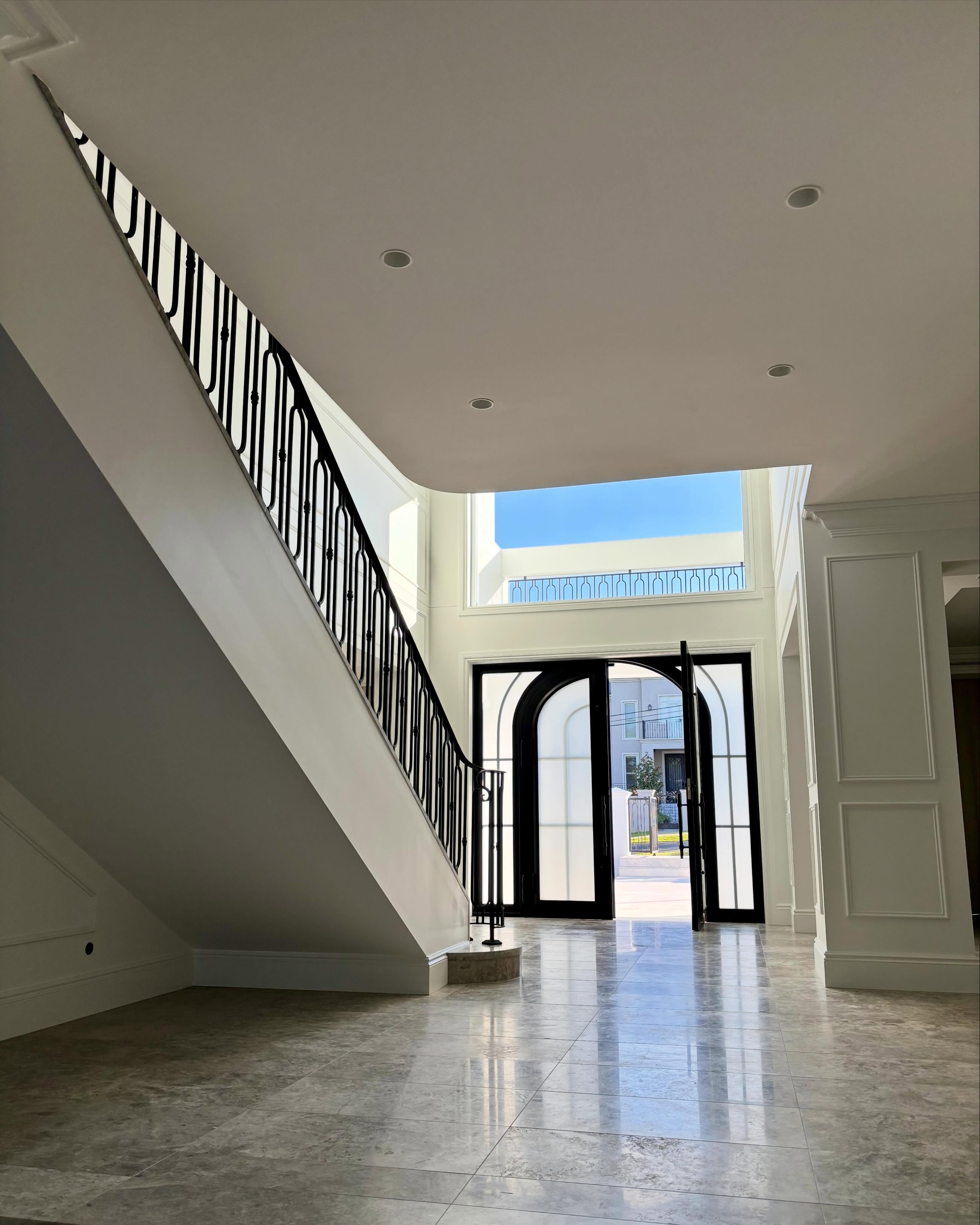 Simple but Elegant Design with matching Entrance Door and Stair Railings.
Matt Black Wrought Iron w. White Backgrounds for max contrast.