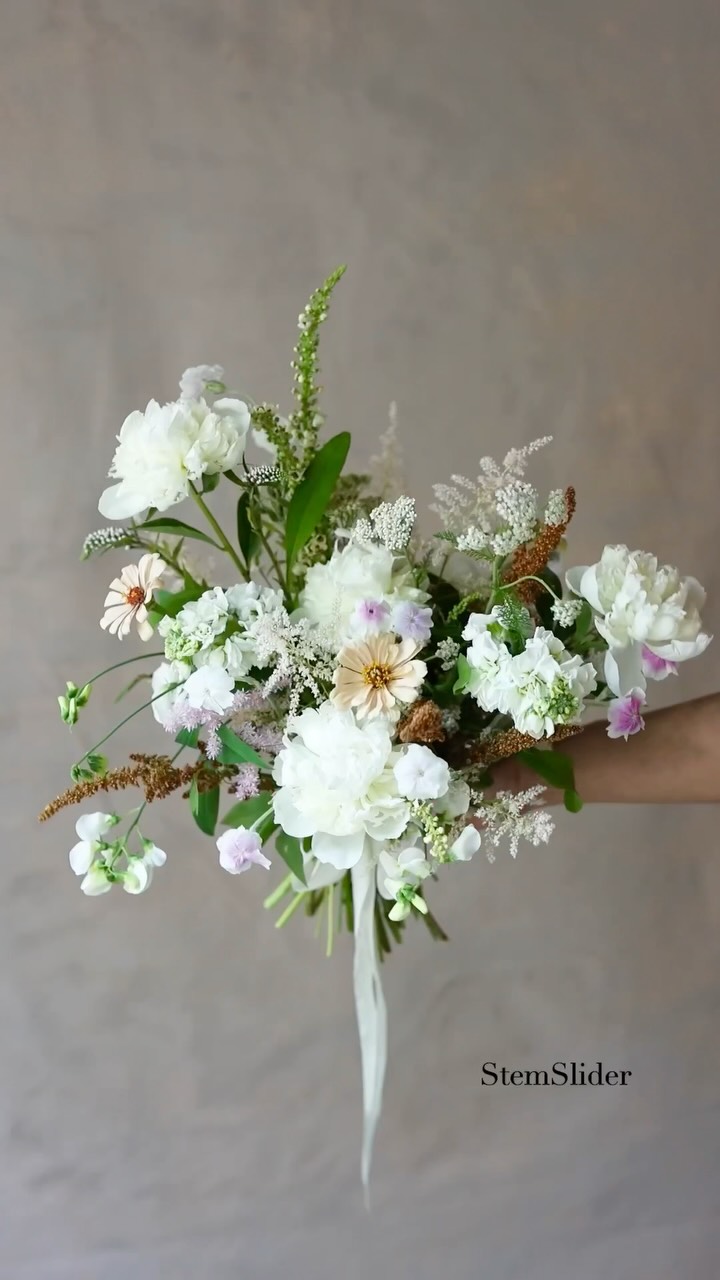 Looking back at the bouquets Keiko and I created together using the StemSlider and mini-StemSlider throughout May and June. 💐
We truly enjoyed designing with peonies, tulips, anemones, and so many other beautiful spring and early summer flowers.
Each bouquet had its own personality from loose garden-inspired designs to structured asymmetrical compositions, and even classic triangular shapes.
One thing I’ve learned is that it’s worth exploring styles or shapes that are new to you or a little outside your comfort zone. Whenever you have the chance to try something different, you discover something new about the flowers and about yourself as a designer 😊
Now July is here, and we’re so excited for dahlia season. I can’t wait to start creating bouquets with my favorite flower!
.
.
.
.
.
#stemslider #ministemslider #flowerbouquets #weddingbouquets #flowertool