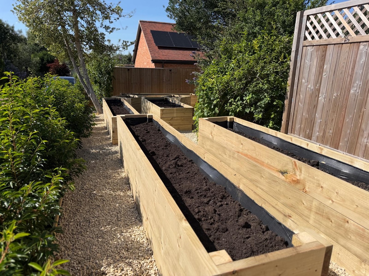 Built from scratch, made to last! 🌿🪵
What a project this has been! 💪☀️
Our landscaping team has been hard at work this week creating this beautiful collection of bespoke handmade raised vegetable beds 🥕🥬🌱
Each bed was carefully measured, cut, and built on-site to perfectly suit the customer’s garden. With plenty of tight measurements and challenging angles, this wasn’t a straightforward installation—but the team absolutely smashed it! 👏👌
Once the beds were built, they were lined and filled with a rich blend of quality topsoil and well-rotted manure, creating the perfect growing environment for vegetables, herbs, and flowers 🌼🥔🍅
To complete the project, we laid decorative gravel between the beds, creating clean walkways that not only look fantastic but also help keep everything neat, practical, and easy to maintain ✨
Working in this week’s heat wasn’t easy 🥵☀️, but seeing the finished result made every minute worthwhile. The combination of the handcrafted timber beds, fresh gravel, and rich planting soil has completely transformed this space into a stunning and productive kitchen garden 🌿🏡
A fantastic effort from the team and another happy customer! 🙌
Thinking about adding raised beds or transforming your garden? We’d love to help 👇
M.J.B Group Ltd
Tree & Garden 🌿
📱 01225 - 941139
📧 info@mjbgroup.co.uk
💻 www.mjbgroup.co.uk
#landscaping #raisedbeds #gardendesign #kitchengarden #gardenprojects