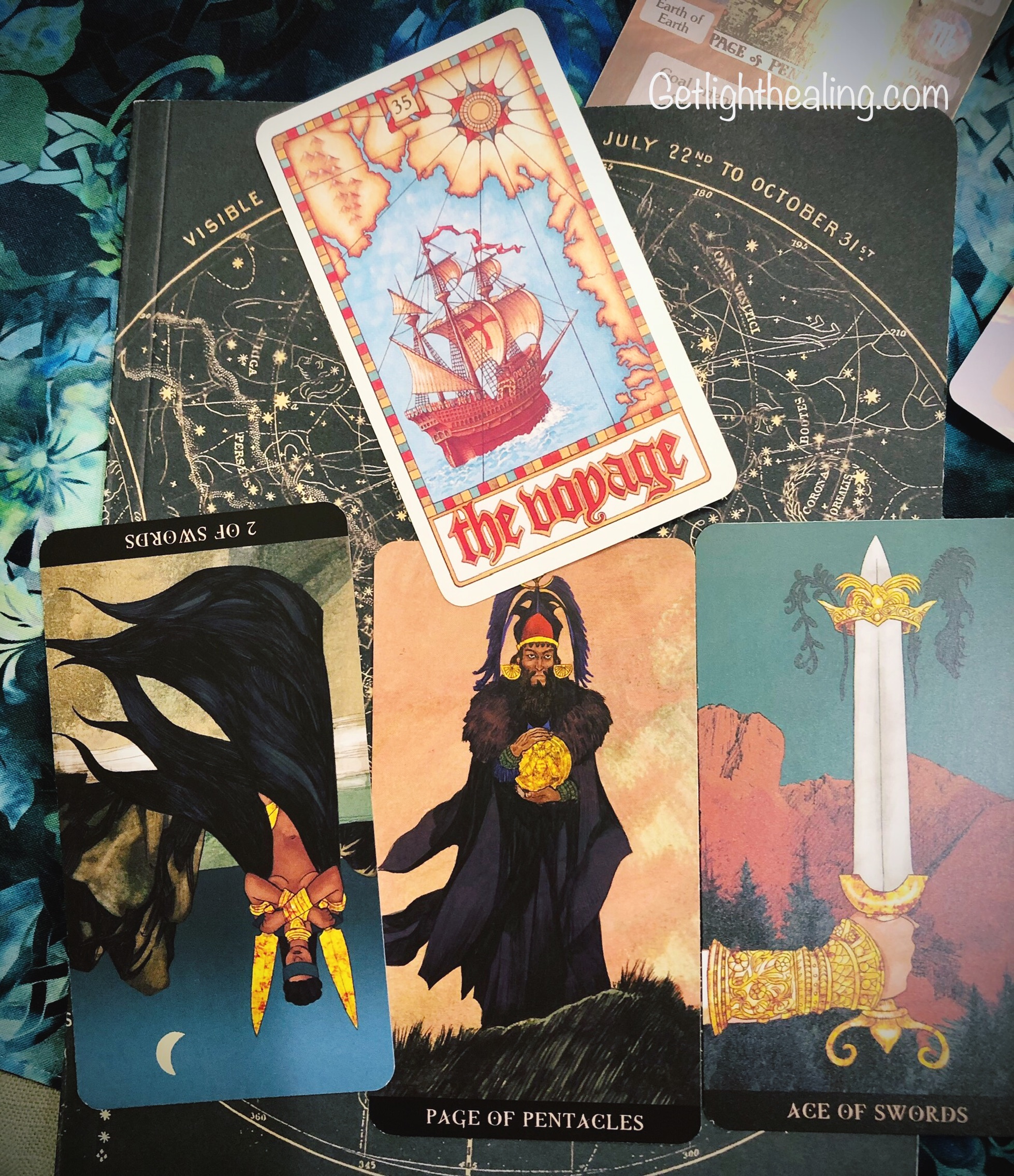 Guidance for week of July 19, 2026:“The Map is not the Territory”
Another card of exploration appears this month. The Voyage speaks to a curiosity for charting new territory; the conscious decision to travel outside your comfort zone, to take the wheel, break old boundaries and cast yourself into new ventures. It’s a rite of passage of sorts: you won’t be the same person who first set out. You change as the landscape changes, and so do the people within it. As the saying goes, “He who travels the furthest, travels alone.” There are those who would rather cling to their old worlds, fixed in their opinions, than prepare for a new one. You may find yourself caught in this very place, hesitant to make a decision one way or the other. Perhaps there’s an uncertainty, even an anxiety, surrounding a looming choice~one that could be seen by another as “a switching of allegiances.” Will they make it “a thing”? That question is likely on your mind, and it’s probably the real reason you’ve been slow to pull the trigger. While others can be factored into the choices we make, we ultimately have to decide and do what’s right or fair for ourselves, based on the reality we’re actually living in. This is the territory you now find yourself in. New landscapes sometimes call for new actions, new truths, new beliefs, and maybe new alliances. How someone takes it isn’t fully within your control; that depends on their level of maturity. The appearance of the Page suggests they may be immature about it. You can’t help that ~it is what it is. While there’s a chance it could bring a new conflict, it could just as easily bring a new level understanding. New insights and greater clarity can be gained as truths come to light. A double-edged thing that always brings its own set of challenges.
Theme: The Voyage
What can you change? Two of Swords reversed
What cannot you change? Page of Coins
What you may not be aware of? Ace of Swords
