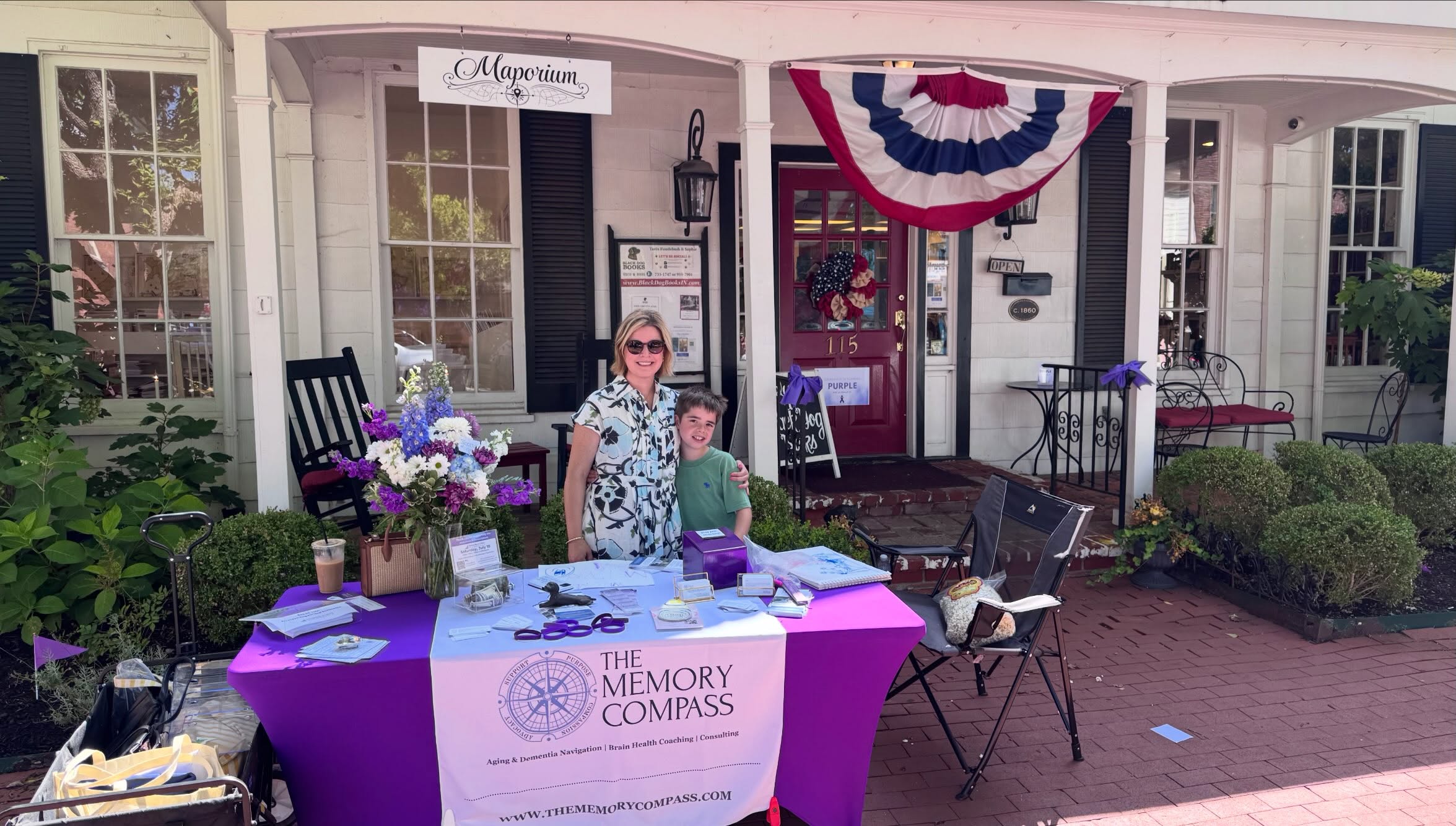 @memoriesonmainzionsville has done a wonderful job yet again with their annual event in honor of the @alzassociation. It has been awesome to see all of the businesses on Main Street and beyond supporting such a meaningful cause within our own community. Thank you to @blackdogbooks for your kindness today 😊 I loved having my son with me for a bit to learn about what I do, the ins and outs of being an entrepreneur, and how “mom” helps families navigating dementia. His favorite part was the perk of the farmers market popcorn 🍿 If you come out to town today proceeds from various local businesses will go towards the cause. I ordered my bouquet from @blooms.by.dragonfly and it exceeded my expectations. So beautiful! My breezy linen dress is from @duoboutiquezionsville. I enjoyed an iced lavender latte from @roastedinthevillage and my husband enjoyed @gablesbagelsindy. We truly are a village!