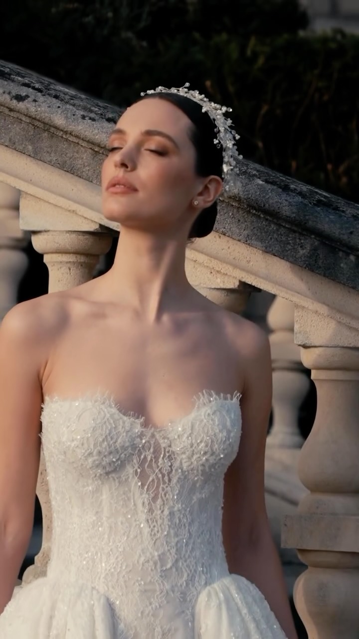 Layers of French lace unfold into a silhouette of effortless grandeur.
A fitted lace bodice meets a sweeping overskirt, bringing together texture, movement, and refined craftsmanship in every detail.
Part of the Impéria Collection.
Book an appointment to experience the collection.
