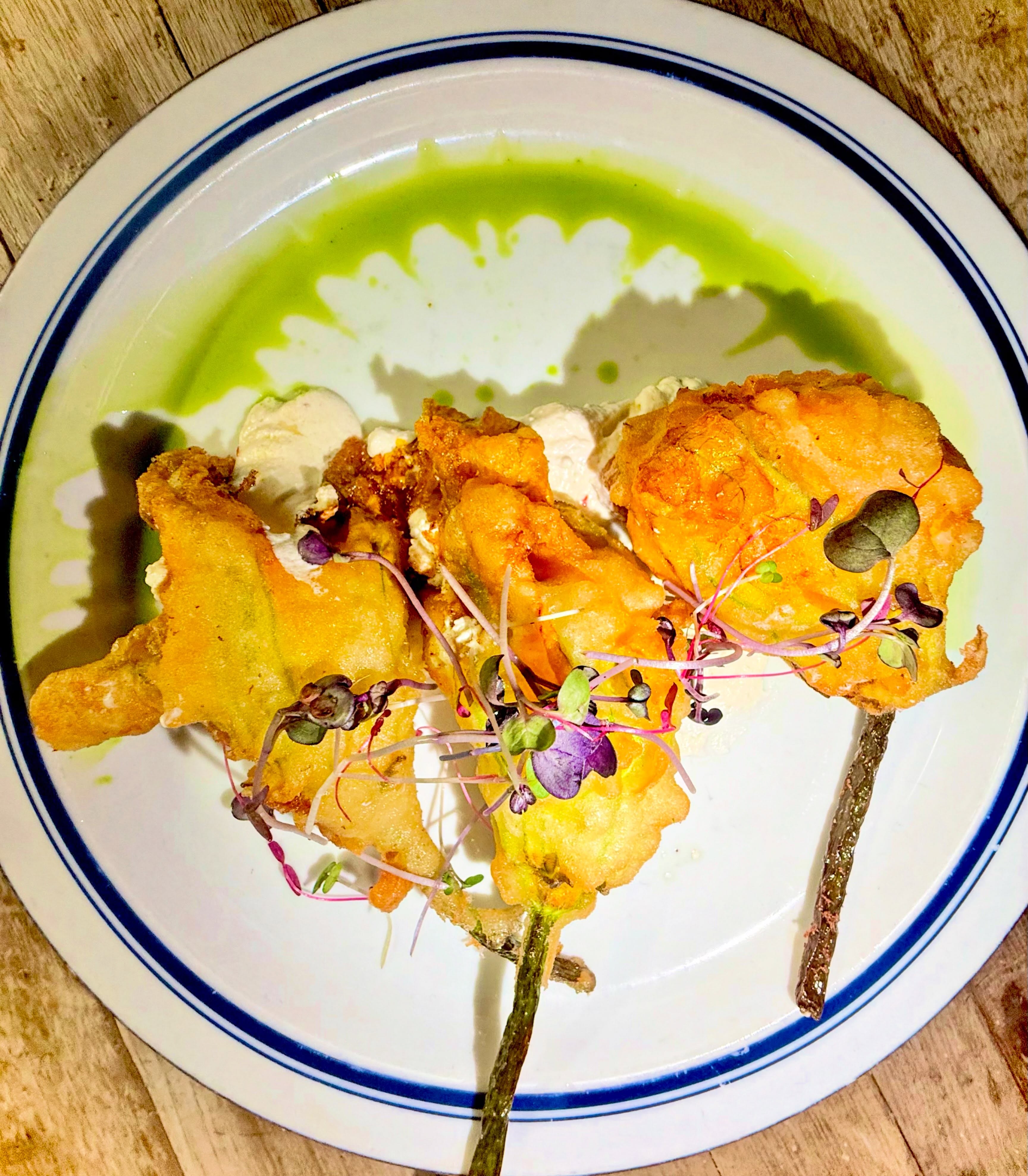 A reminder that every harvest starts with a flower 🌼 It’s squash blossom season, and every bloom feels like summer. Stuffed with luscious ricotta && lightly fried, these taste like sunshine ☀️ and pair perfectly with a patio night out 🍷🍴
