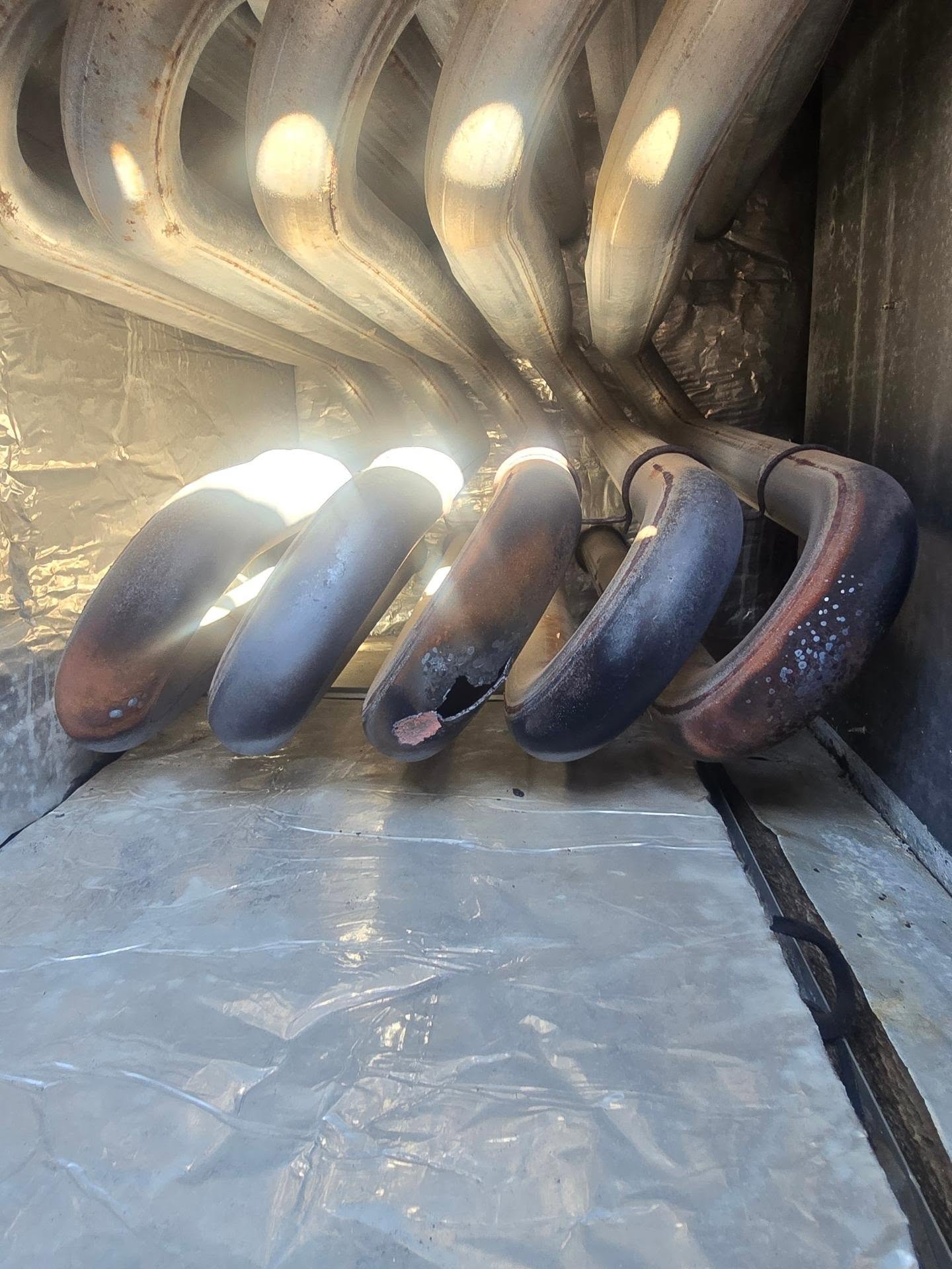 So this is what happens when you change out a unit in the summer time and the customer doesn't know why they were feeling sick during the winter time while running the heater.
Check out this failed heat exchanger on a unit we changed out because of no cooling. How super important it is to have your furnaces checked each year to prevent carbon monoxide poisoning in your home.