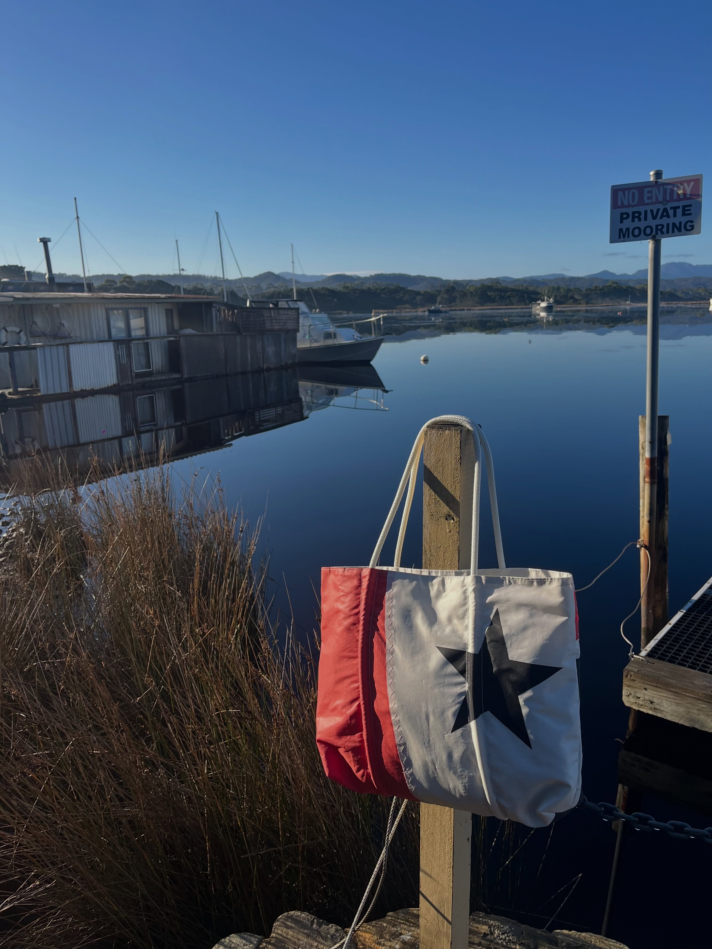 Mornings in a place as stunning as this call for a photo shoot, luckily our nautical style bags made from upcycled sail material look so at home down at the jetty!
