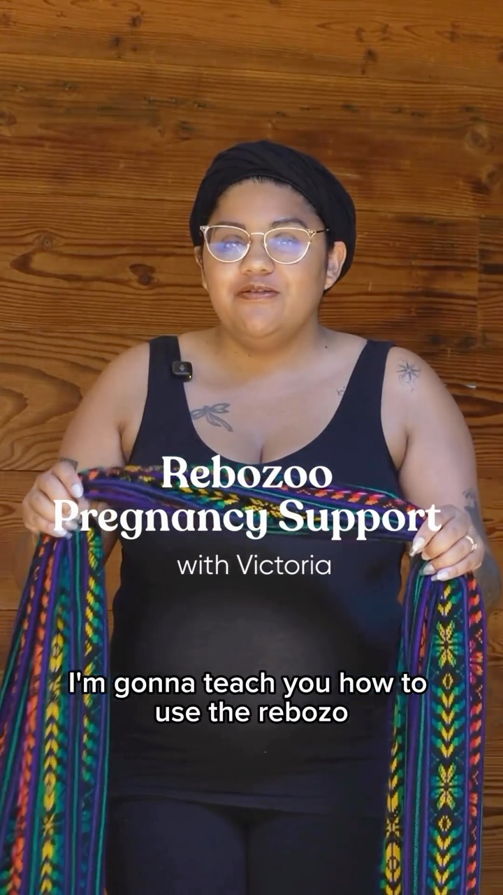 Victoria shows us how to use the rebozo for belly support. This rebozo helps redistribute the weight of your bump to relieve pelvic and low back discomfort. *pretend bump used for demonstration
Victoria is a postpartum doula at The Womb Room supporting new parents. “My goal is to make sure the whole family’s needs are being met, alongside the needs of their babies. Postpartum can often be overlooked, and can feel isolating and overwhelming. I decided to make this career change after noticing the effects on families who never received the benefits of postpartum support, and that I could make a tremendous impact on the wellbeing of the whole family”