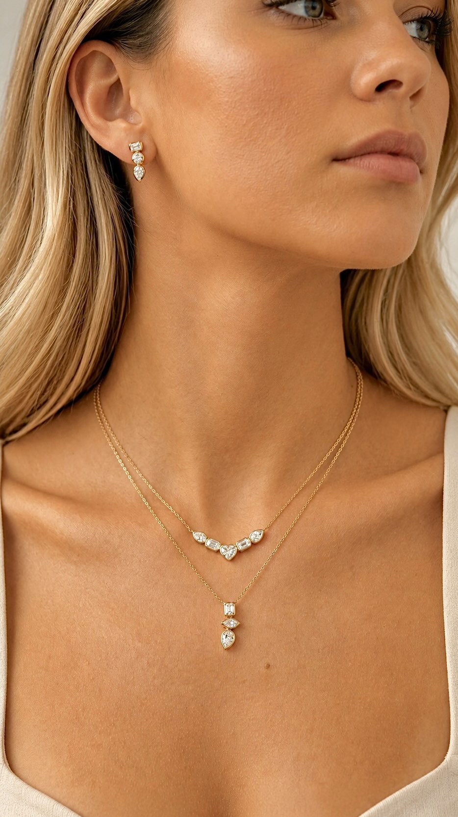 For the moments when ordinary simply won’t do...
A striking trio of emerald, round, and pear-cut diamonds set in radiant yellow gold—designed to catch every glance and hold it. Paired with matching drop earrings, this collection is pure drama, refined to perfection.
#StatementJewelry #DiamondNecklace #LuxuryJewelry #ModernElegance #BoldAndBrilliant