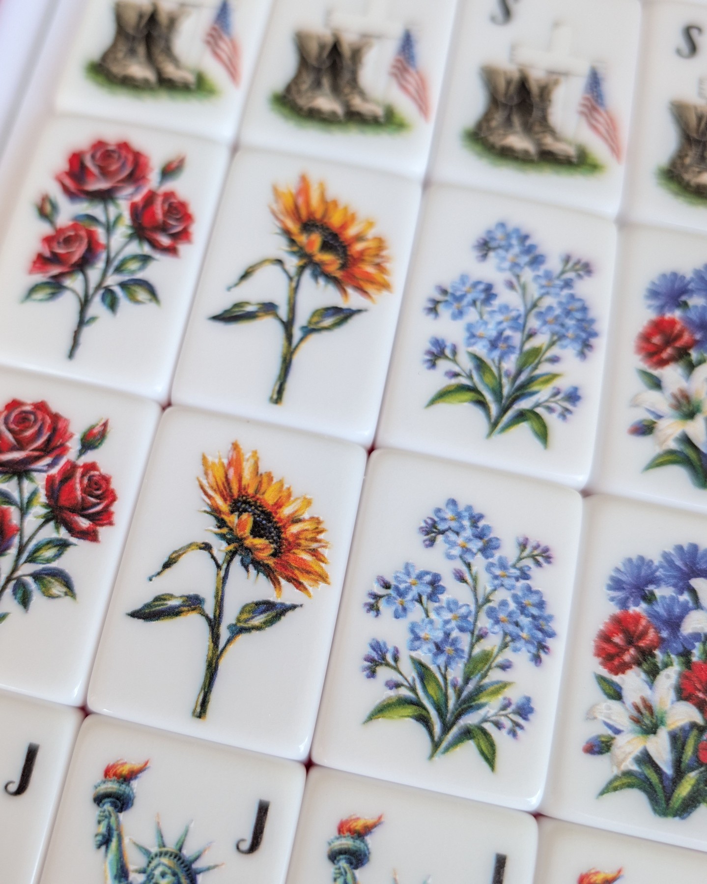 🌸 Flower Friday
Every bloom on these hand-painted mahjong tiles was chosen with intention—a celebration of beauty, history, and the spirit of America.
🌹 **Roses** represent our nation's beloved flower and enduring strength.
🌻 **Sunflowers** honor the resilience, hope, and rich agricultural roots that helped shape our country's story.
💙 **Forget-me-nots** remind us to cherish the people, places, and sacrifices that should never be forgotten.
🌺 **Carnations** symbolize admiration, devotion, and the generations who came before us.
🤍 **Lilies** bring grace, honor, and the promise of new beginnings.
Together, they create a timeless patriotic bouquet—one brushstroke at a time. Every tile is hand-painted original art UV printed, making this set as unique as the stories it will help create around the table.
Happy #FlowerFriday! 🌸
#PatrioticDecor #AmericanMade #Mahjong #HandPainted #CustomMahjong