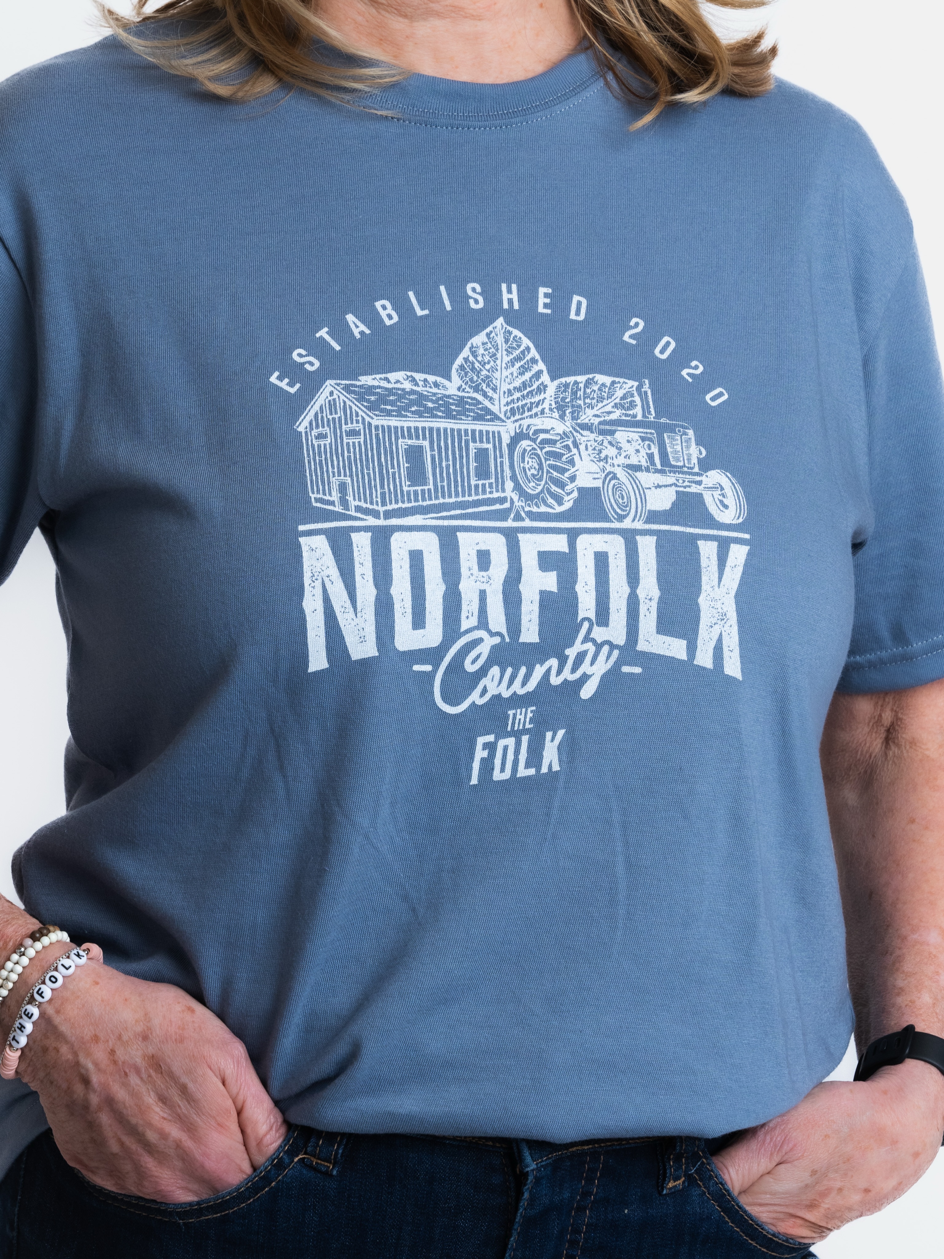 ⚠️ WARNING: Wearing this Norfolk County Tee may cause…
🌽 Strong opinions about sweet corn.
🍓 Sudden stops at roadside farm stands.
🌊 An uncontrollable urge to head to the beach.
🍷 Frequent visits to local wineries and breweries.
👋 Running into someone you know… everywhere.
Side effects may include an increased appreciation for small town life.