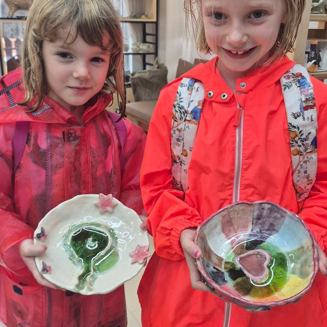 There’s a specific kind of magic that only happens when you pull open a kiln lid after a long firing—but this time, it came with a twist. 🏺✨
These proud potters just took home their very first pinch and coil bowls, but they didn’t stop at clay. They tucked pieces of sea-tumbled beach glass into the bottoms, crossed their fingers, and trusted the fire. What came out? A surface covered in a glorious, web-like "crackaly" texture that no glaze could ever replicate.
Here’s the cool science behind it: it’s called crazing. The melted glass and the clay body actually expand and contract at slightly different rates as the kiln cools. That tension creates those delicate, jagged cracks—turning a simple beginner bowl into a one-of-a-kind ocean relic. 🌊🔥
From beach combing to wheel throwing, there’s nothing quite like transforming "trash" into a functional treasure you can hold in your hands. Swipe through to see the process (and the proud faces!).
Which slide is your favorite? Drop a 🔥 or a 🏺 in the comments if you’d be brave enough to try melted glass in your kiln!
#lantaupottery #holidaycamp #summer2026 #hongkongkids #kidspottery