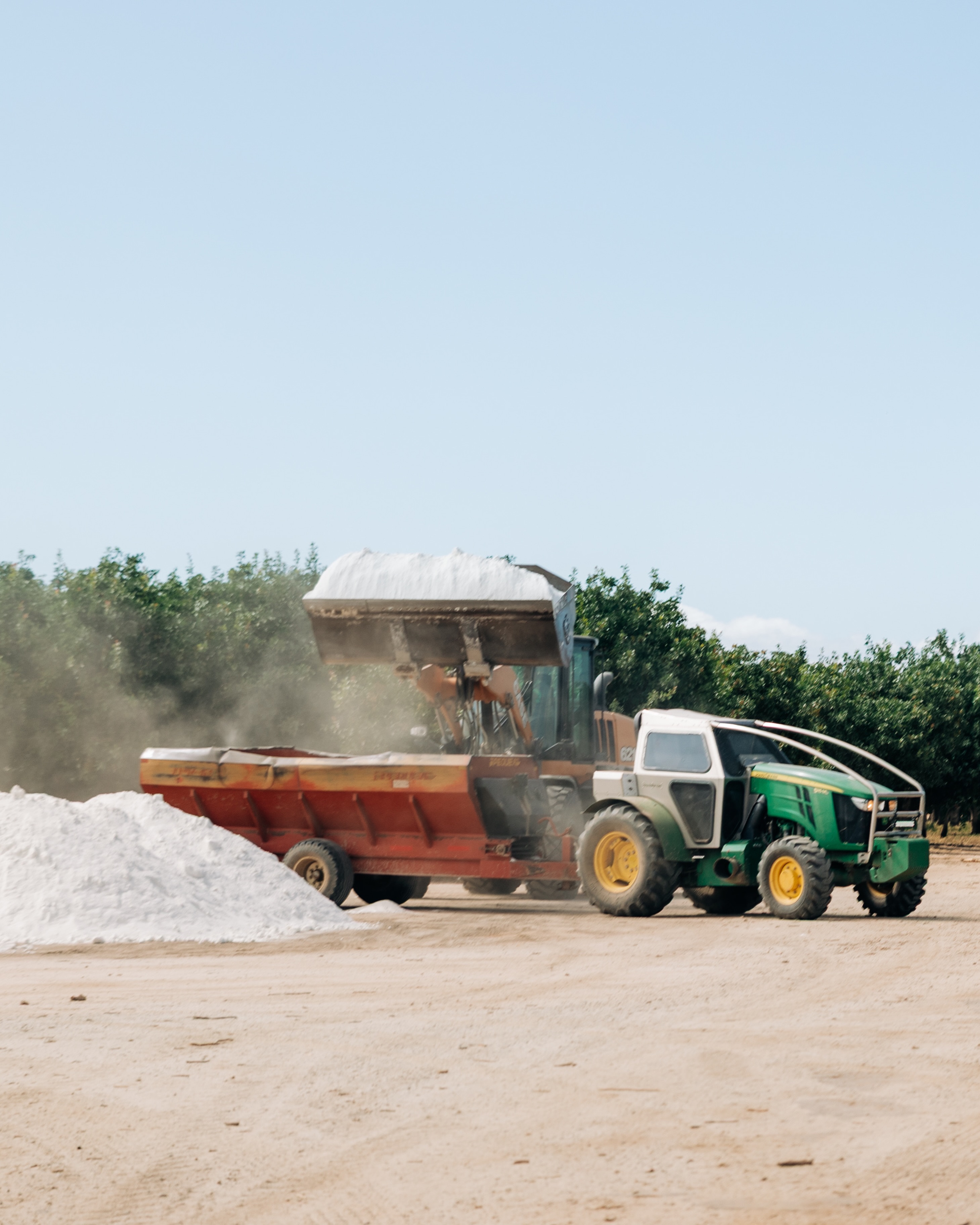 From the pile to the orchard. Getting gypsum where it needs to go. 🌳 #TreeBarber #Gypsum #OrchardCare #GypsumApplication #Agriculture